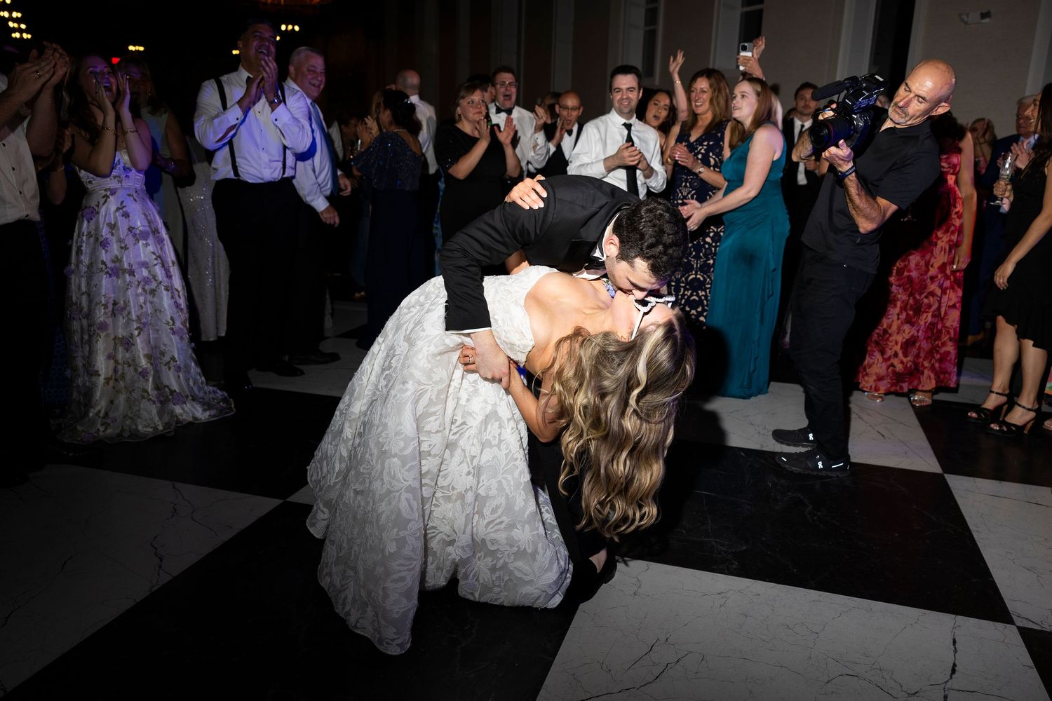 Wedding reception dance floor filled with guests enjoying the celebration.