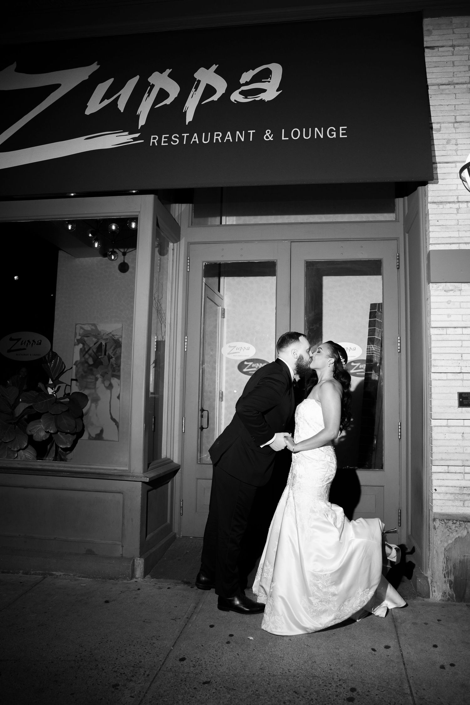 Sequence showing newlyweds entering Filippa's Restaurant and Lounge in formal attire.