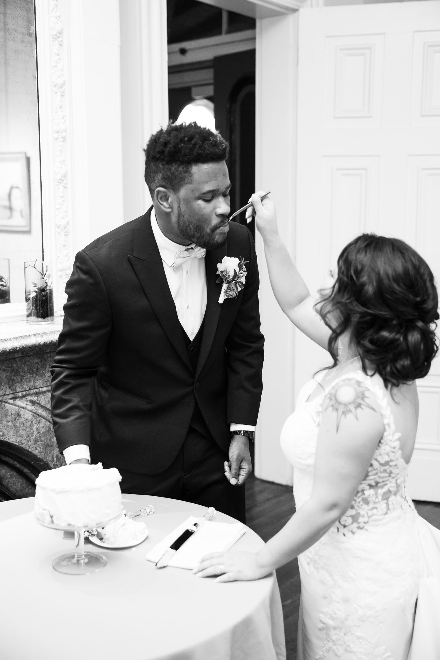 Candid moments of newlyweds enjoying cake and laughter at their reception.