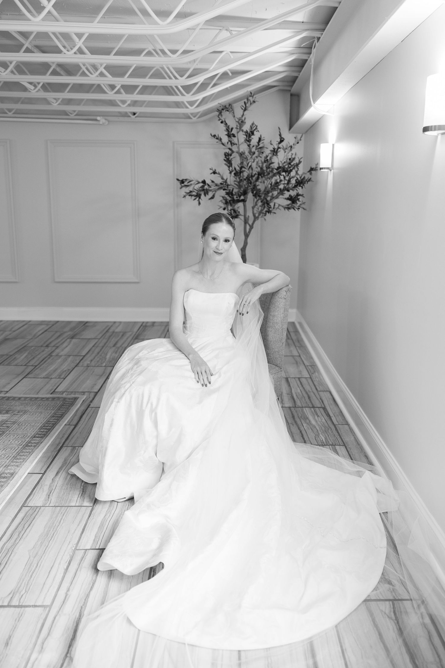 Black and white bridal portrait in minimalist room with architectural details.