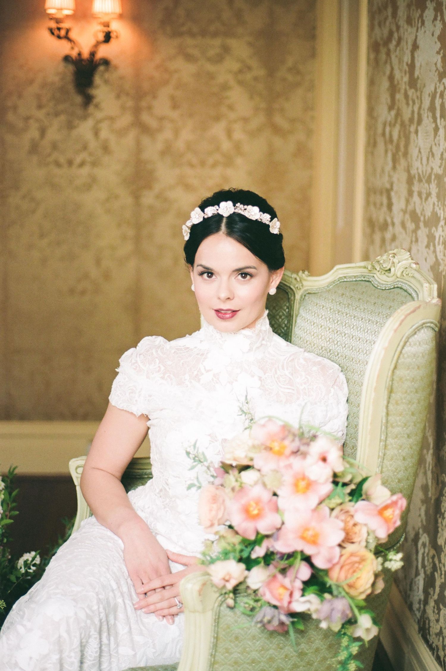 Bridal portrait session featuring a white dress and peach-colored bouquet.