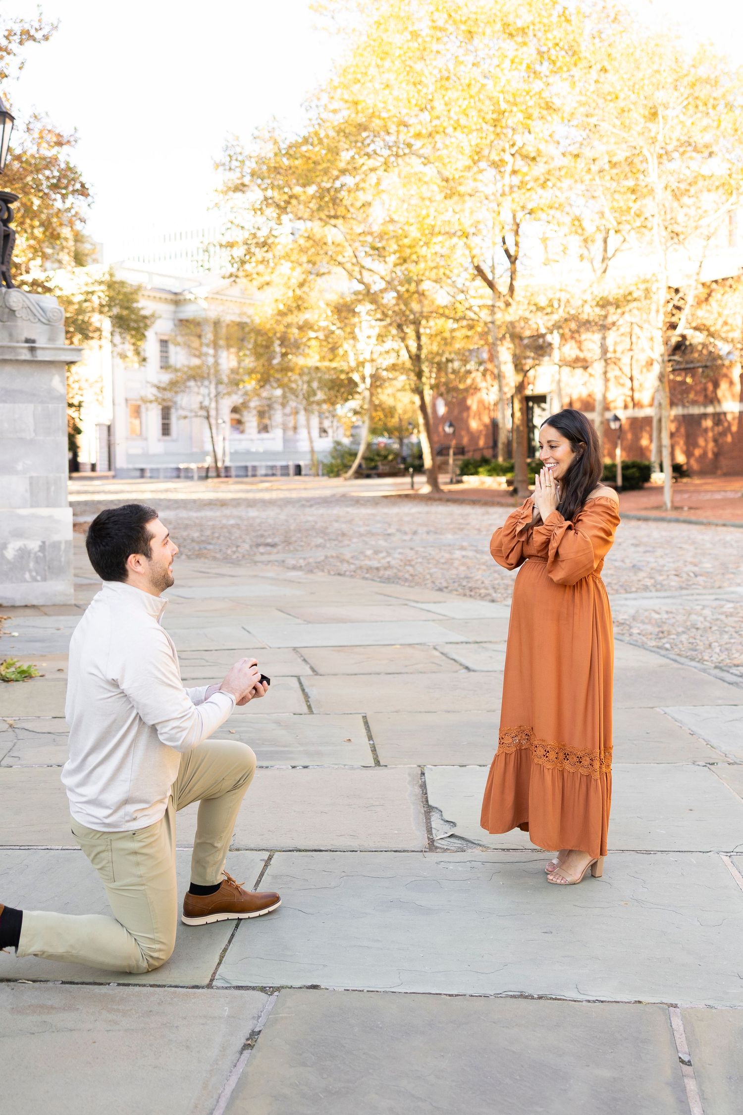 A surprise proposal moment captured in a series of photos at sunset.
