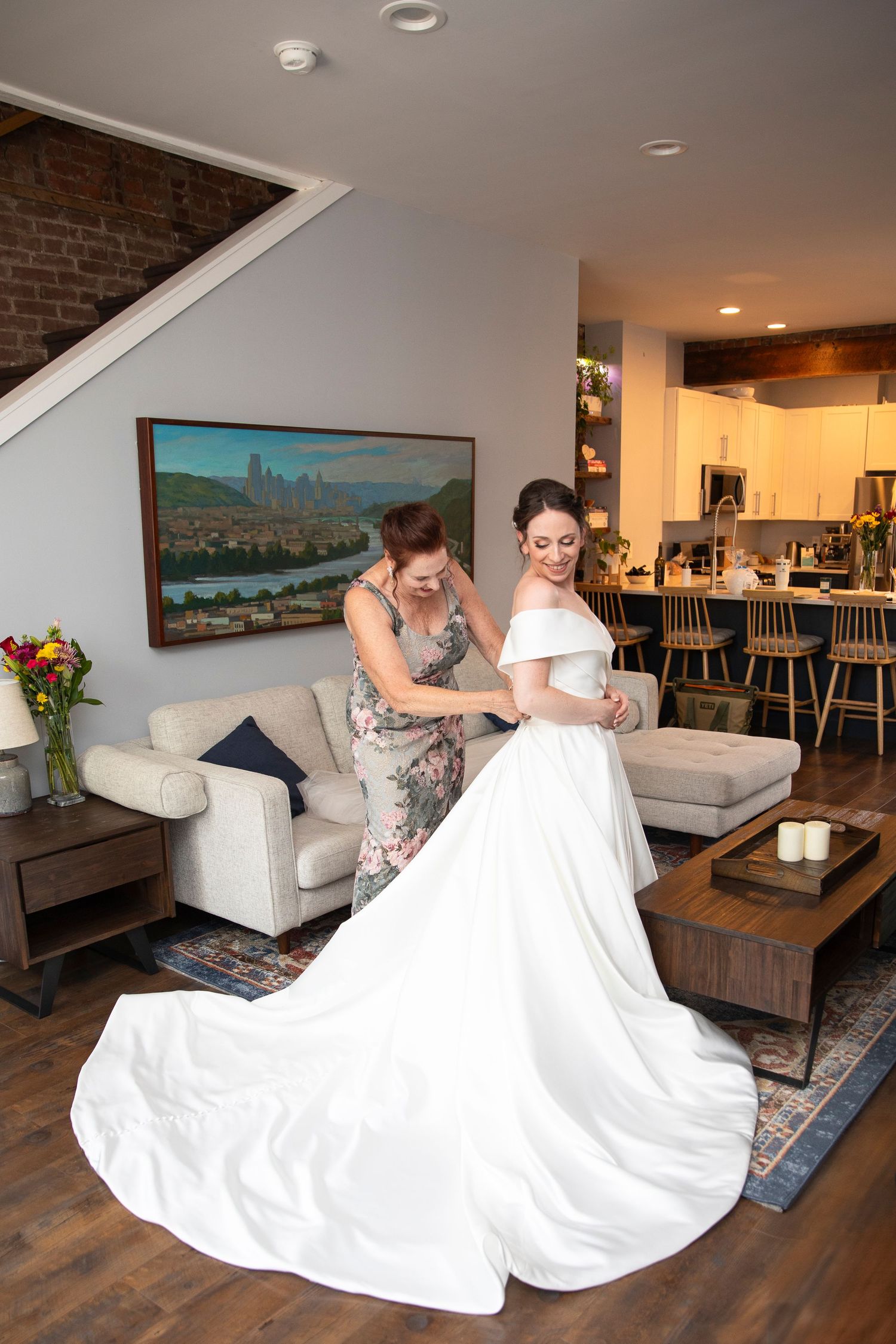 Interior room with white furniture and wedding dress preparations in progress.