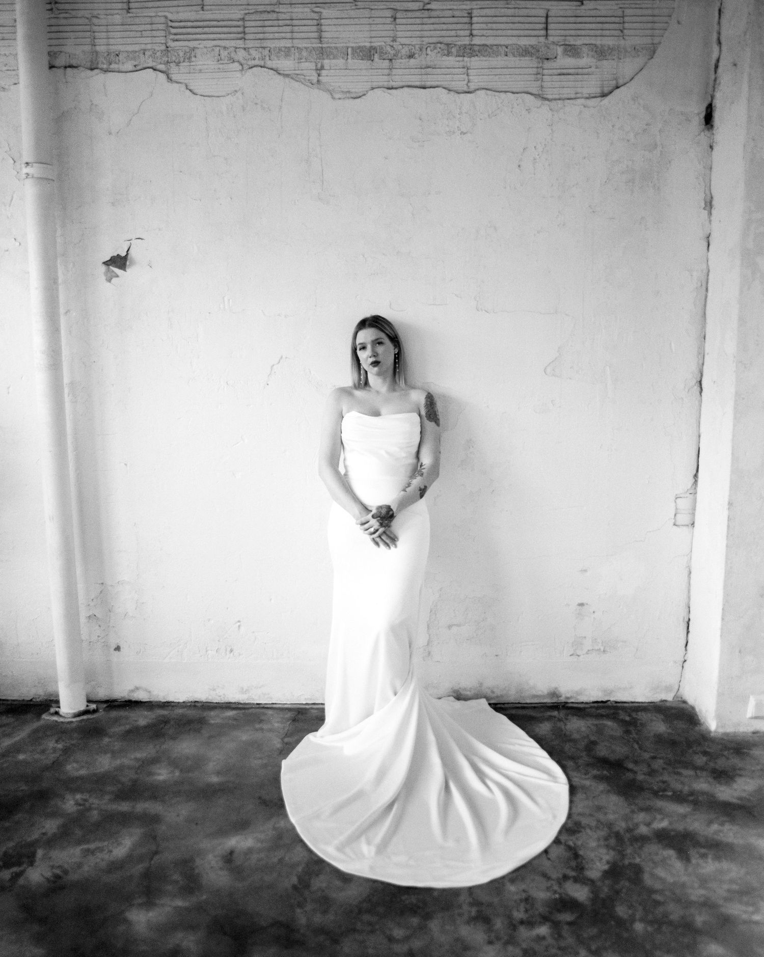Dramatic black and white bridal series showing movement and flow of wedding gown.
