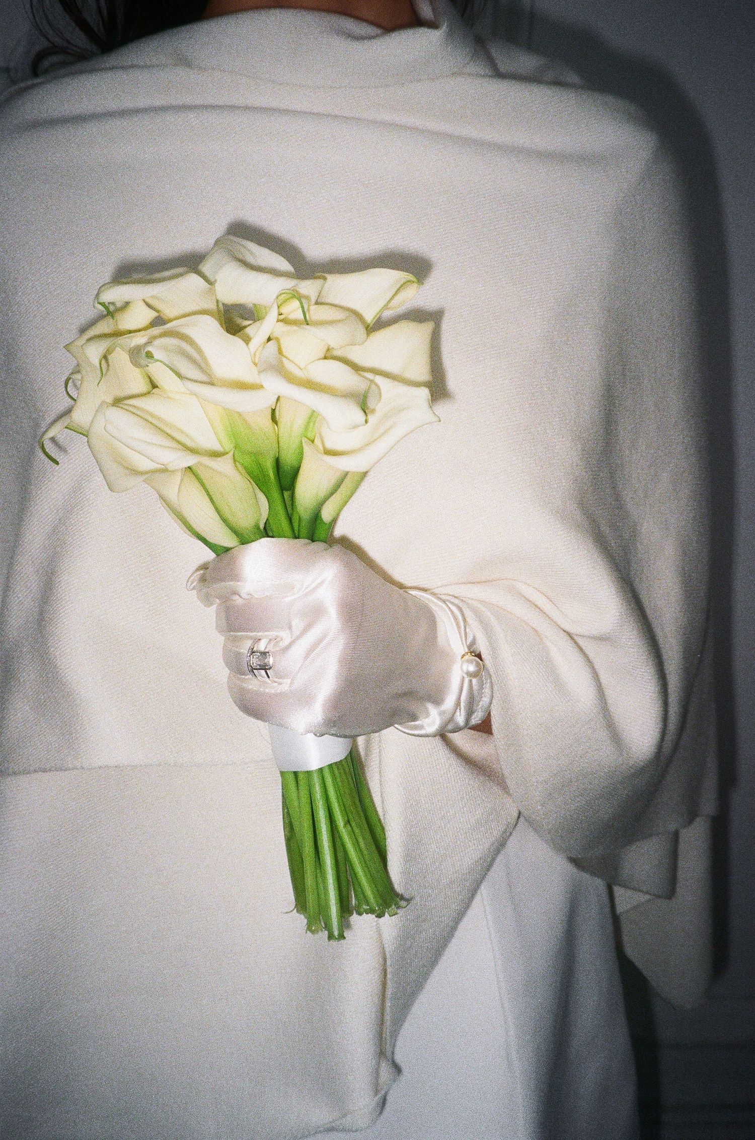 A sequence showing white calla lily bouquet against a light background.