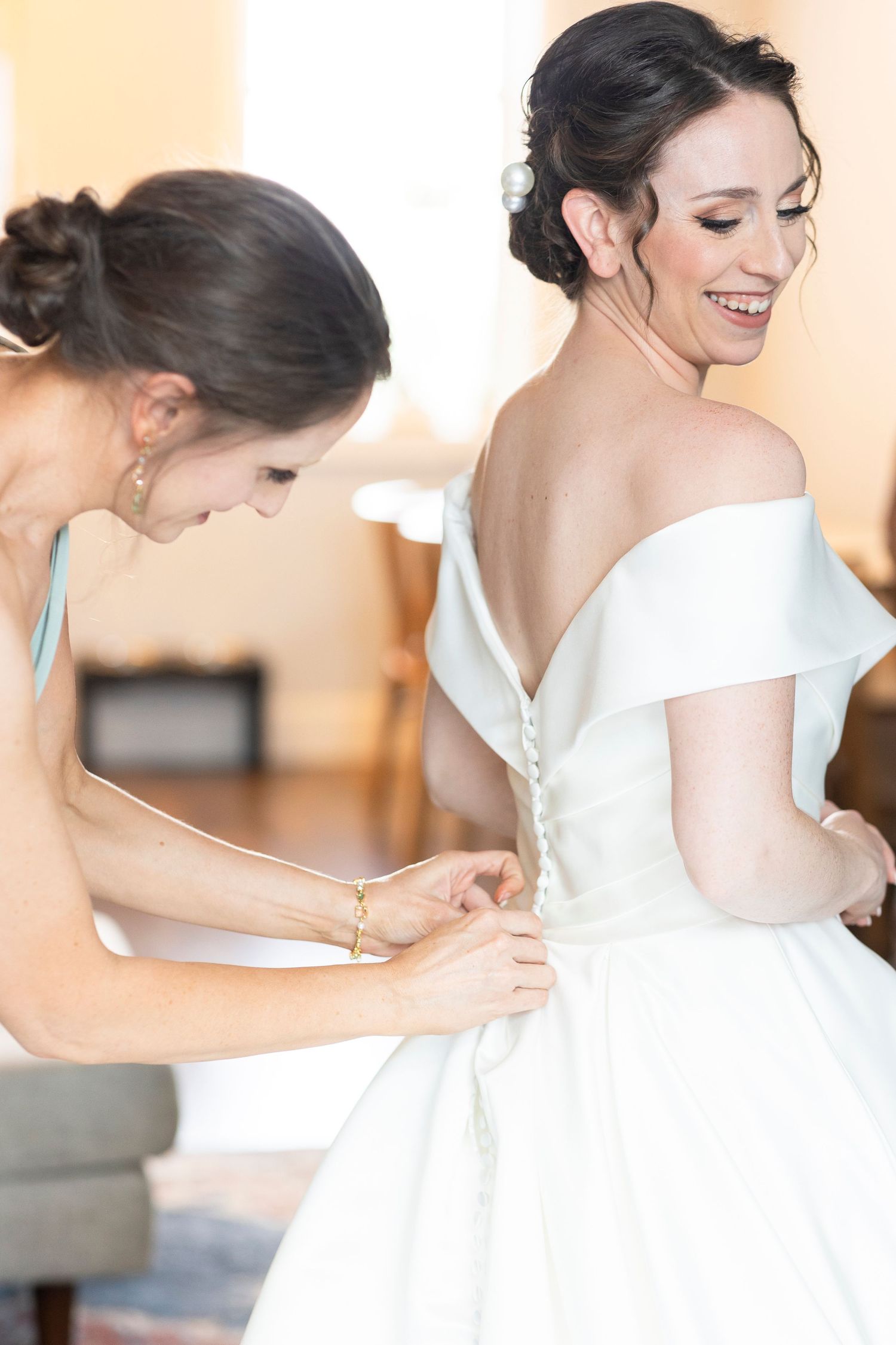 Elegant bridal preparation sequence showing dress details and styling moments.