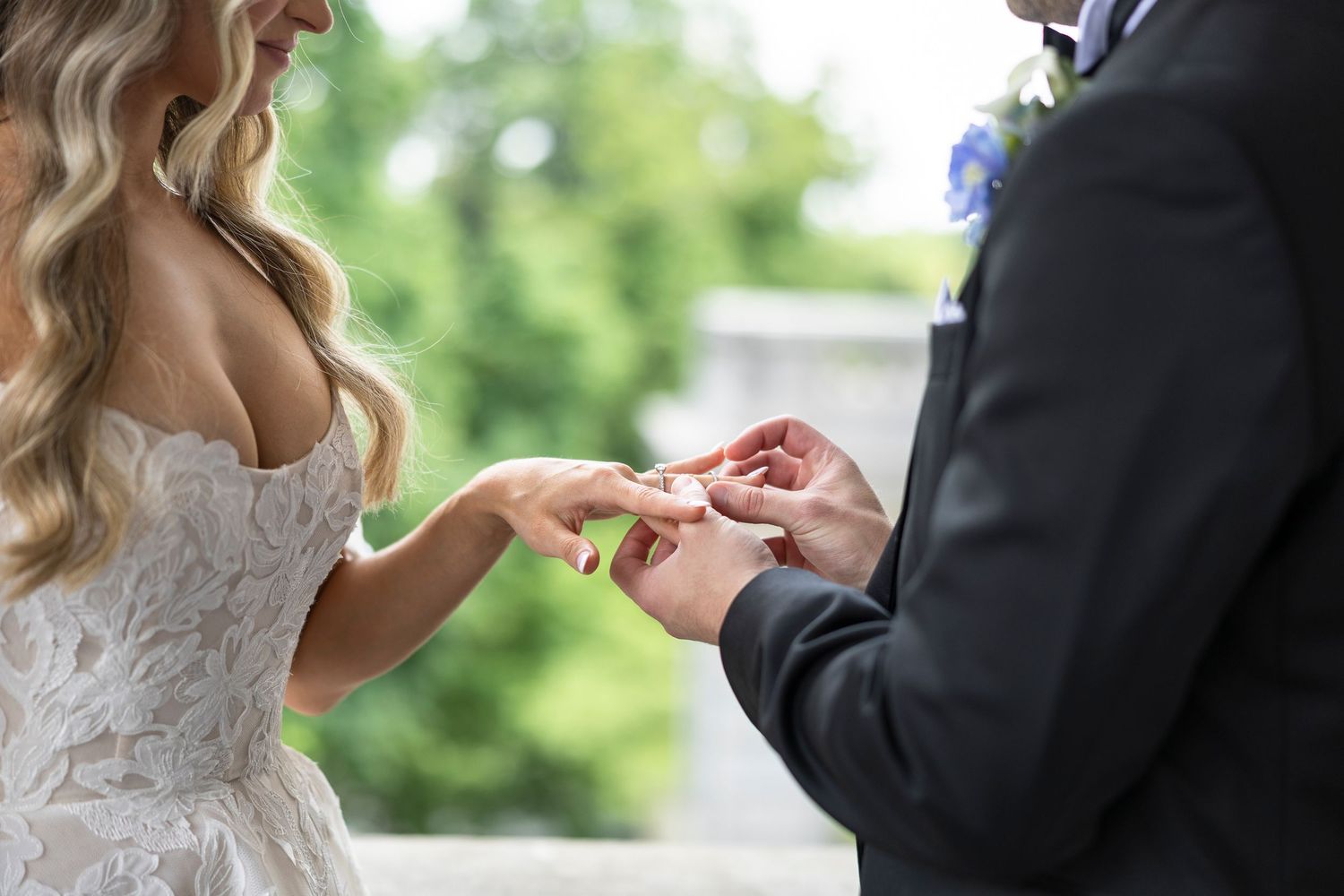 Wedding couple exchanges handwritten letters during their first look moment.