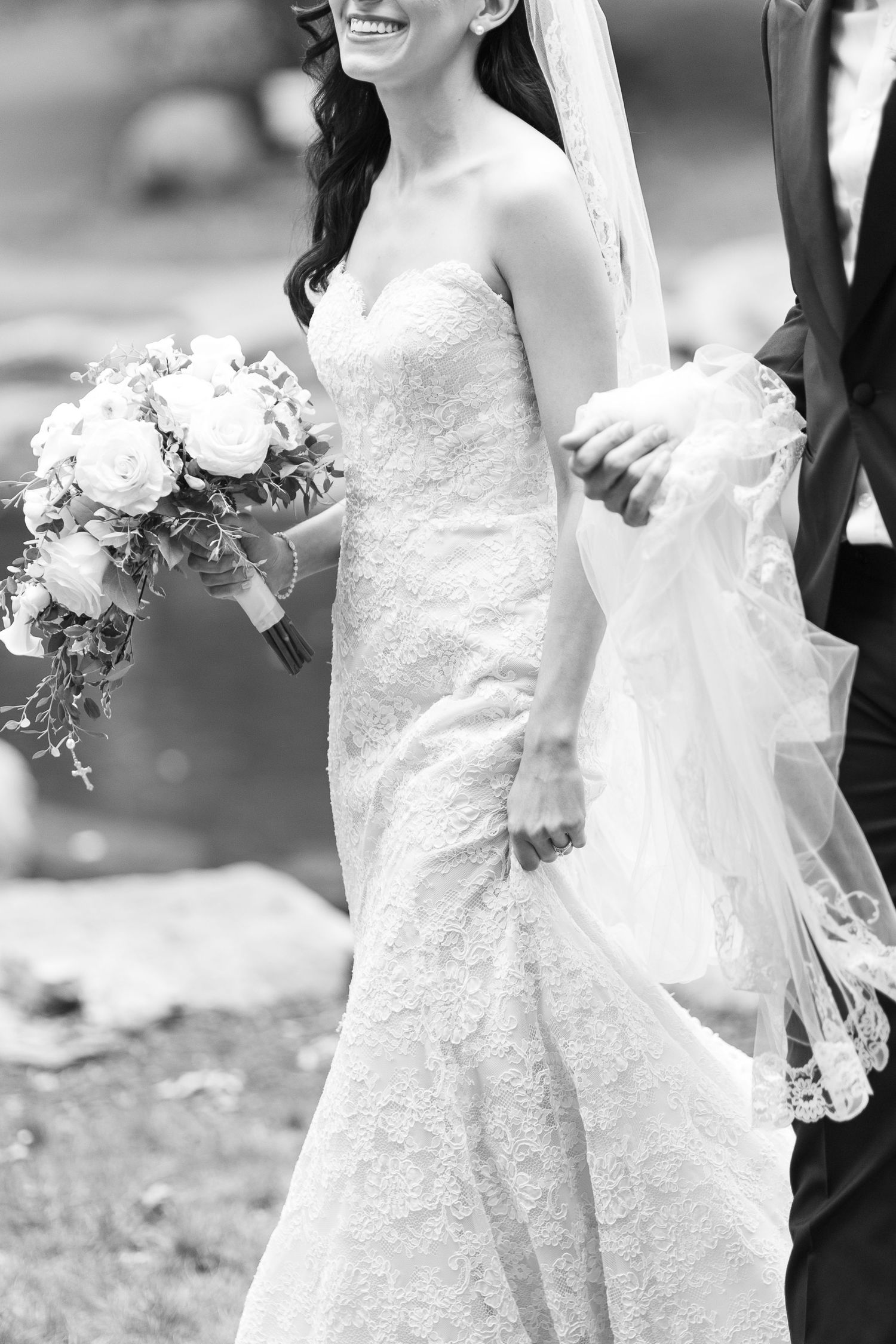 Black and white detail shots of wedding dresses and bouquets.