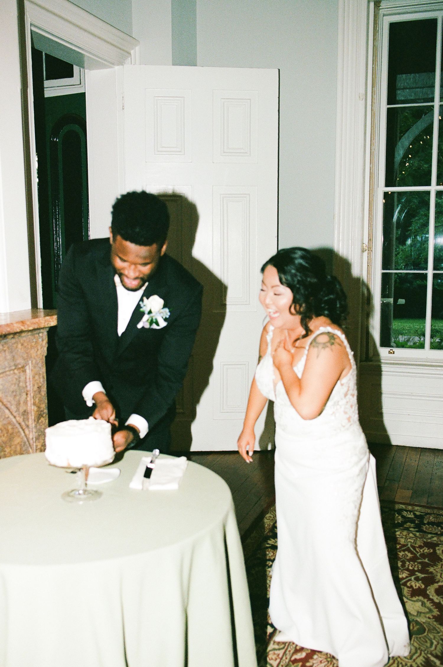 Candid sequence of newlyweds sharing laughter at reception table.