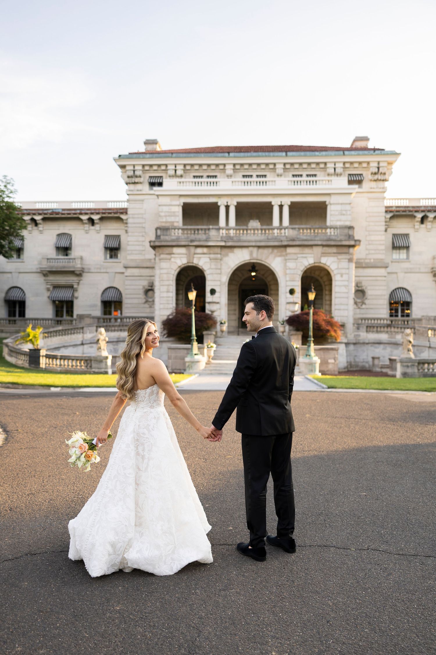 A series of wedding poses captured outside an elegant stone mansion with arched windows.