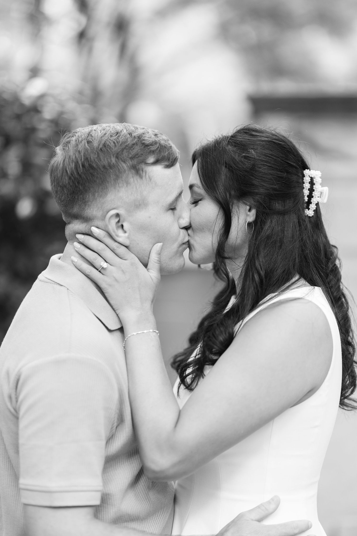 Black and white intimate portrait sequence showing tender moments between a couple.