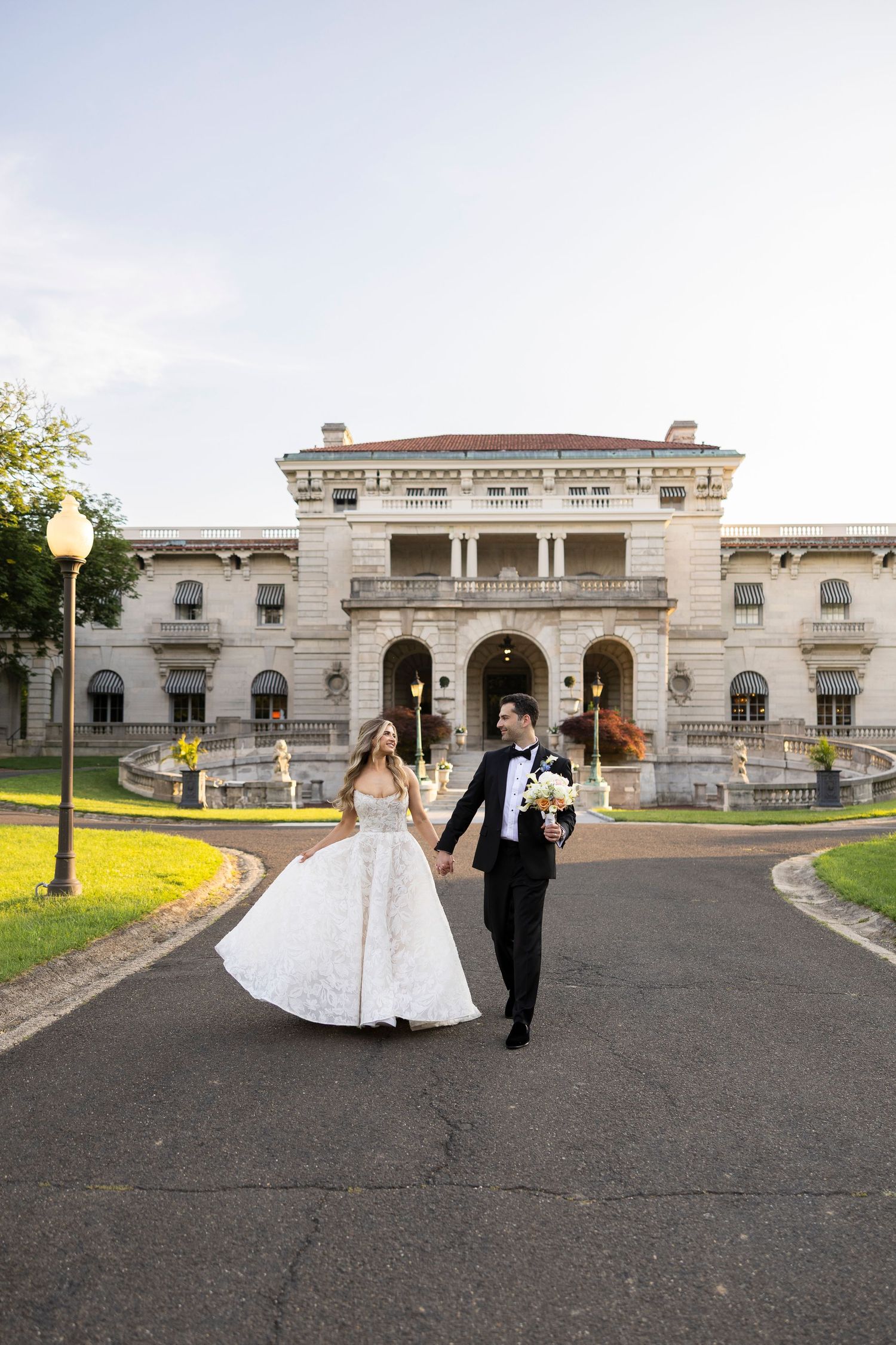 A wedding photo sequence outside a grand historic mansion with classical architecture.