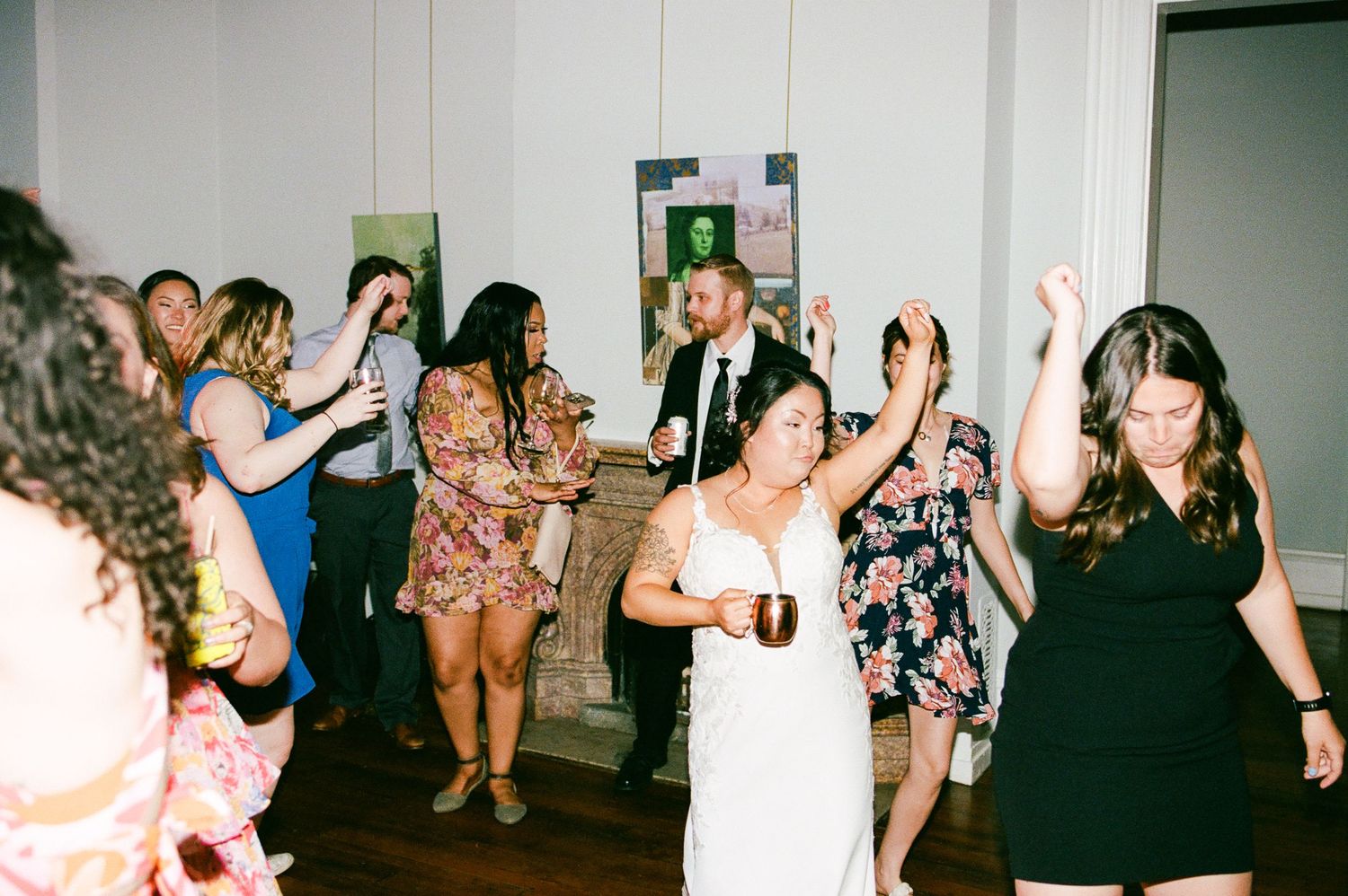 A collage strip of candid party photos showing people dancing and celebrating together.