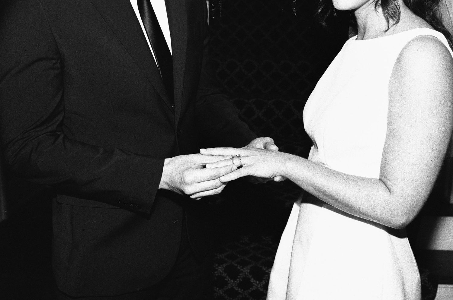 Candid black and white wedding photos capturing intimate moments between newlyweds.