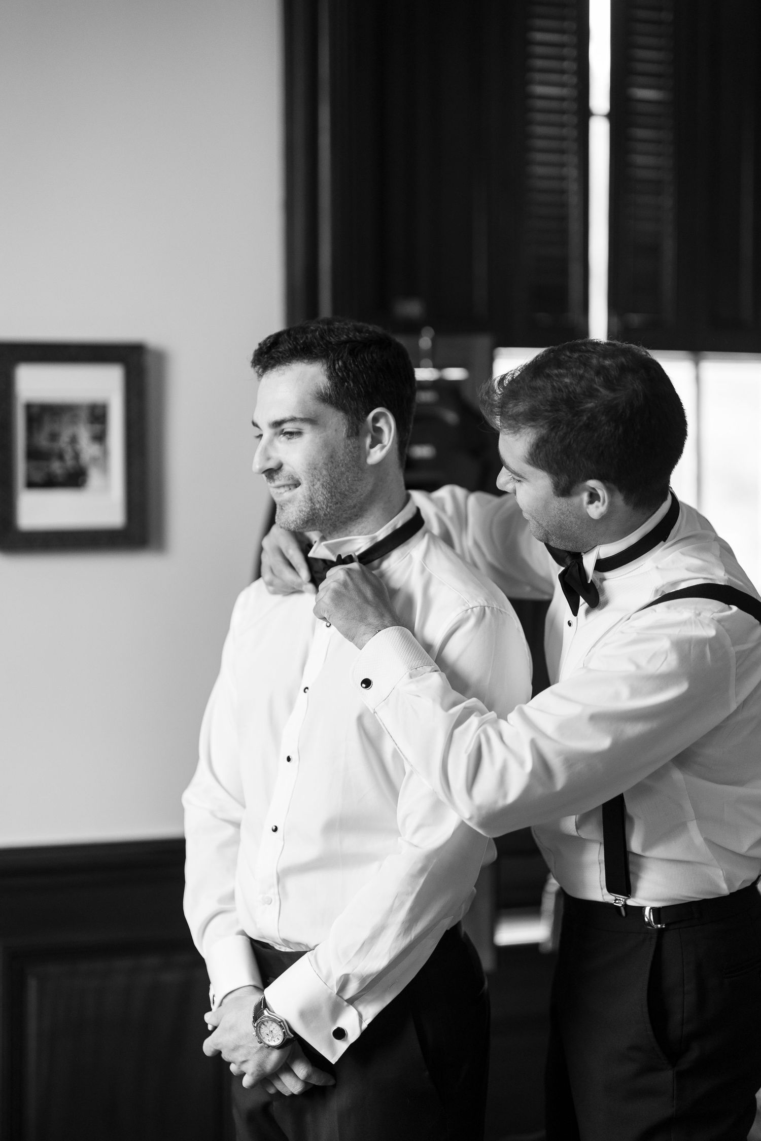 Black and white sequence of men in formal attire adjusting bowties.