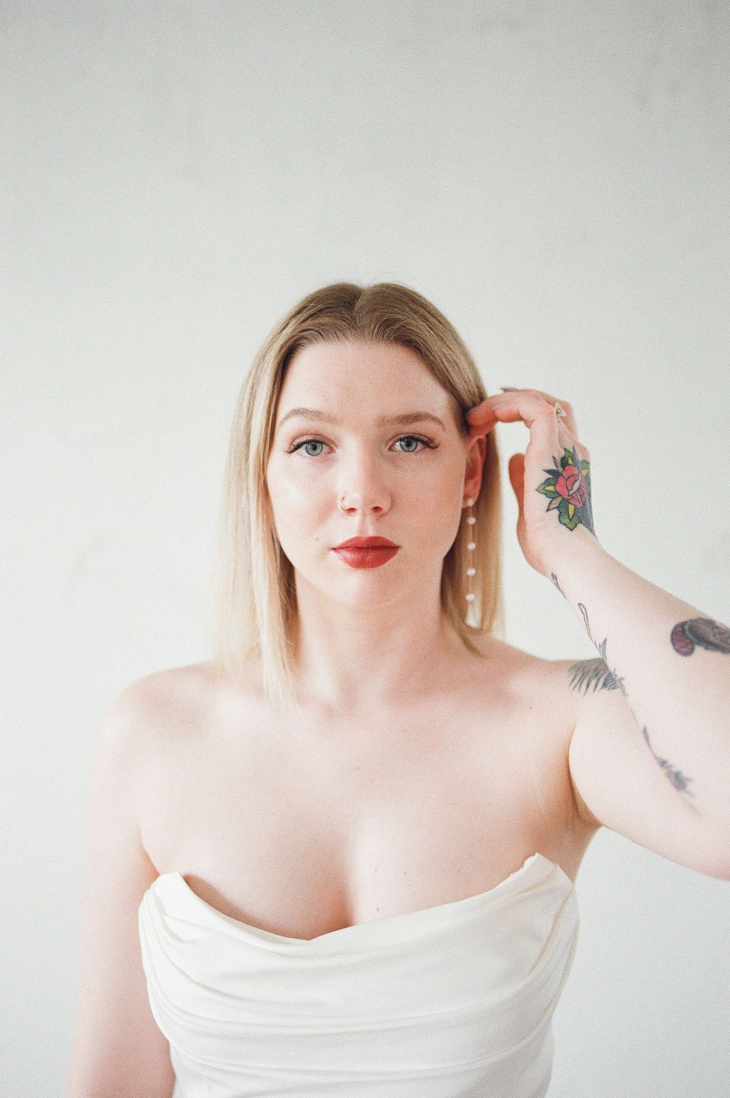 Close-up portrait series highlighting off-shoulder neckline and artistic details.