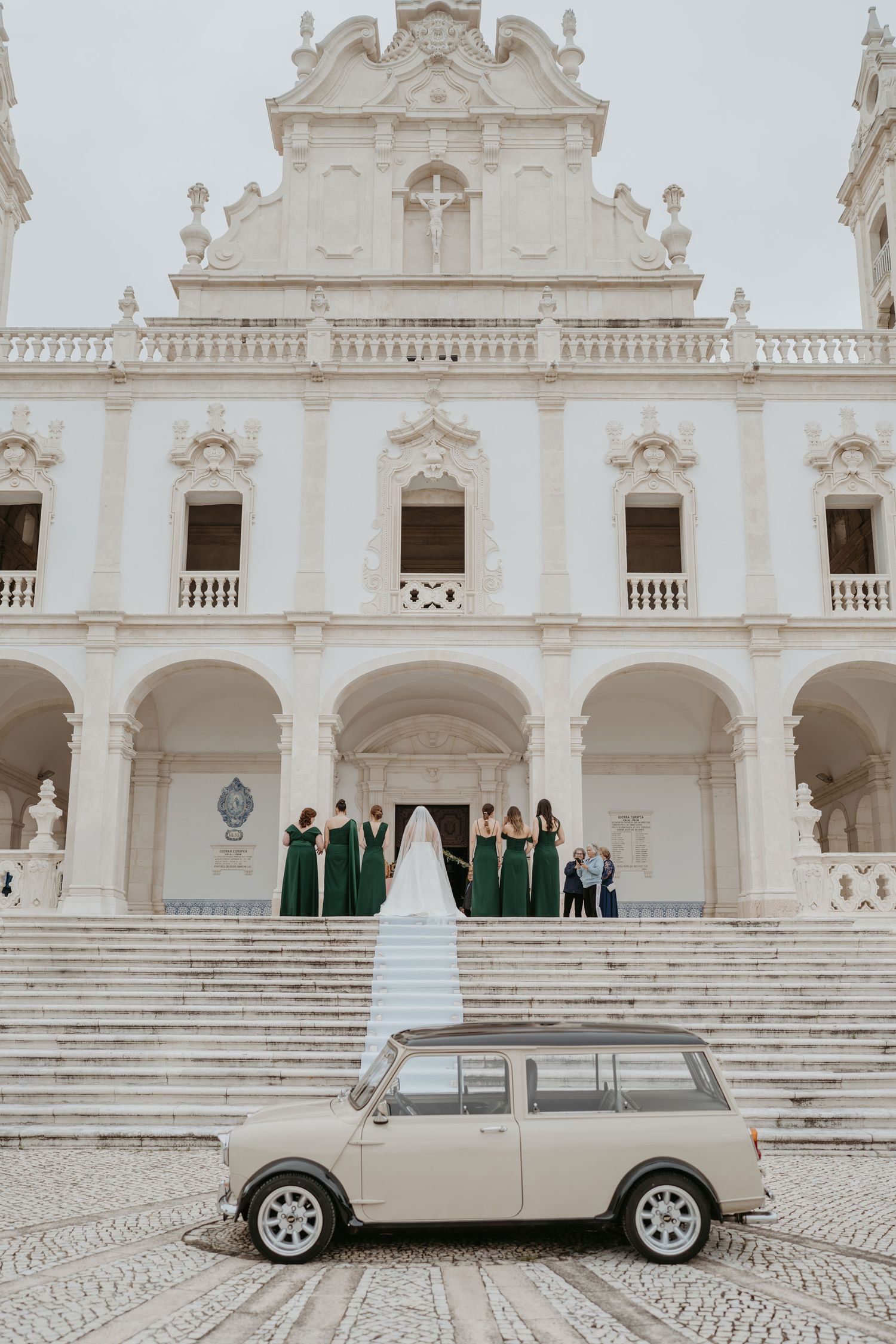 Wedding celebration outside an elegant historic church in Portugal