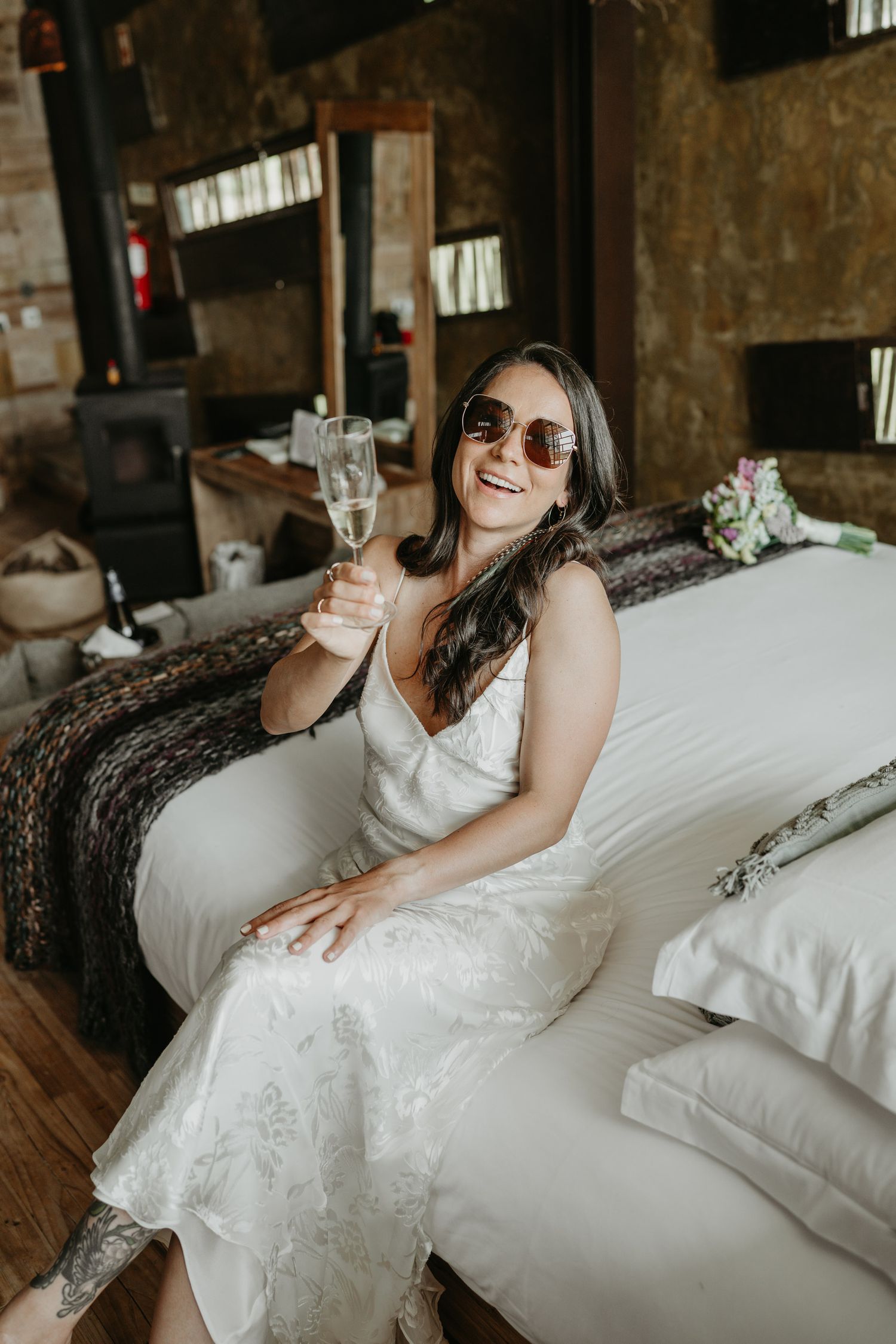 Candid portrait of a bride relaxing before her wedding ceremony