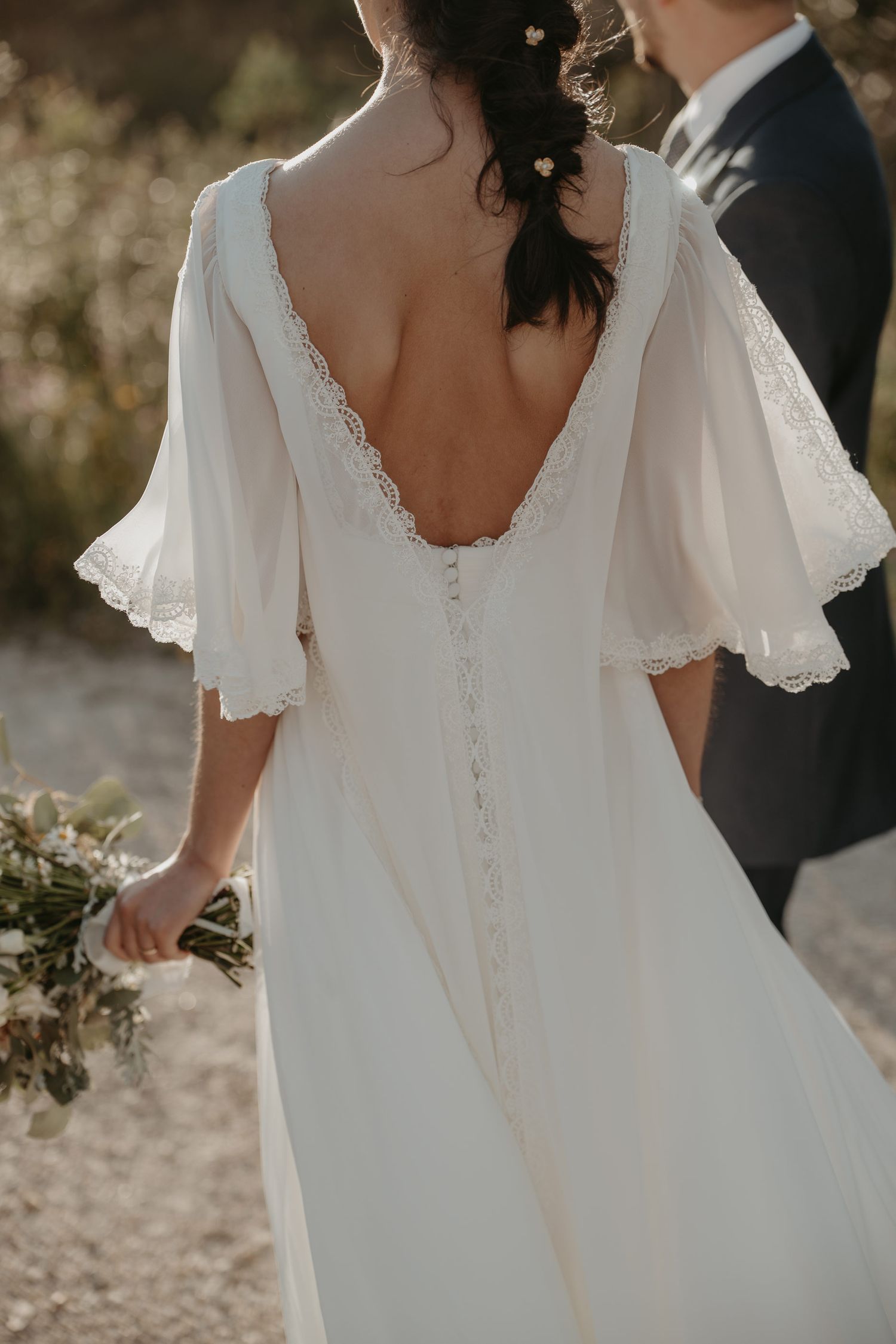 Bride walking outdoors in a elegant wedding dress