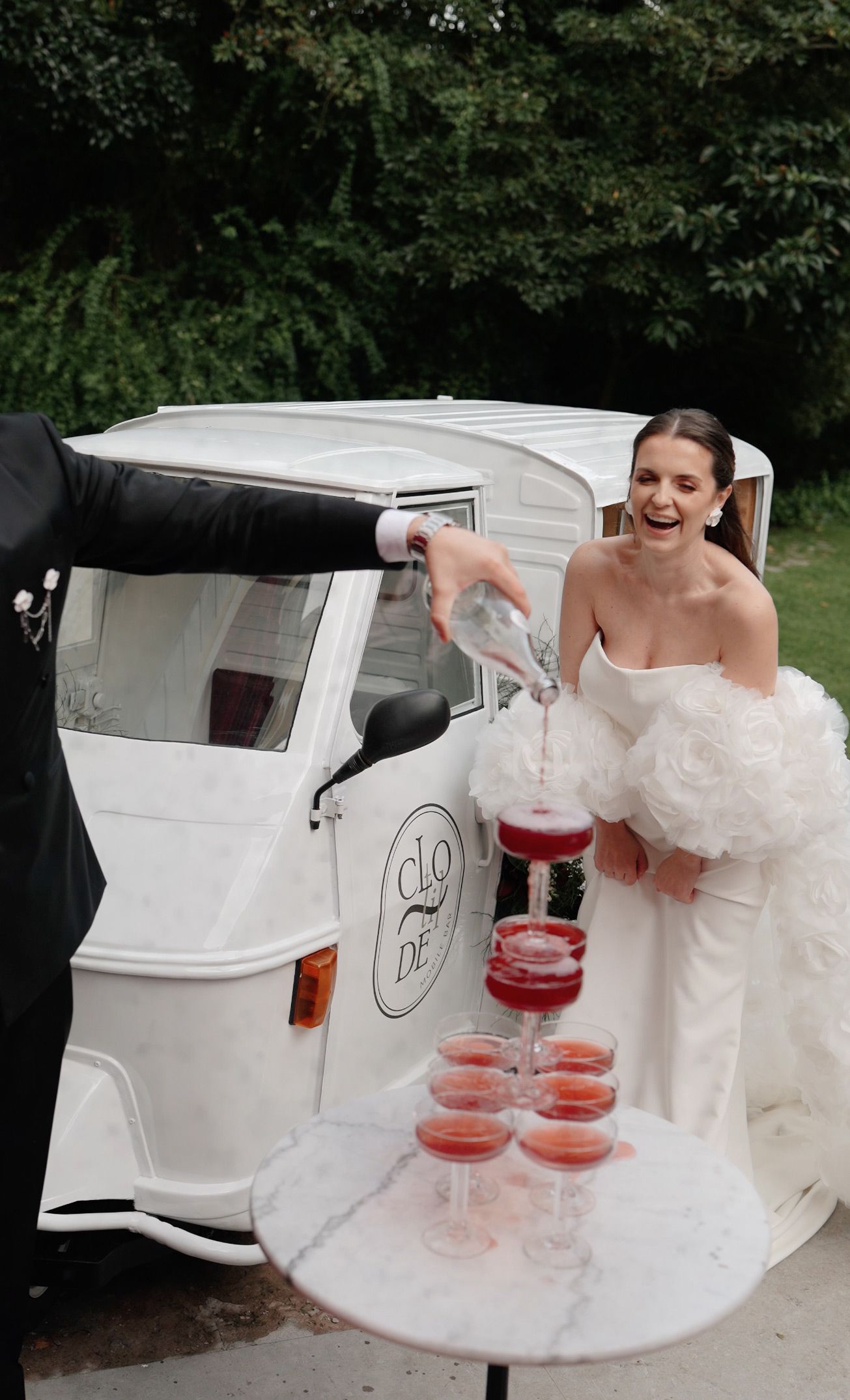 Bride beside a vintage wedding car at Camélia Gardens, Sintra, Portugal