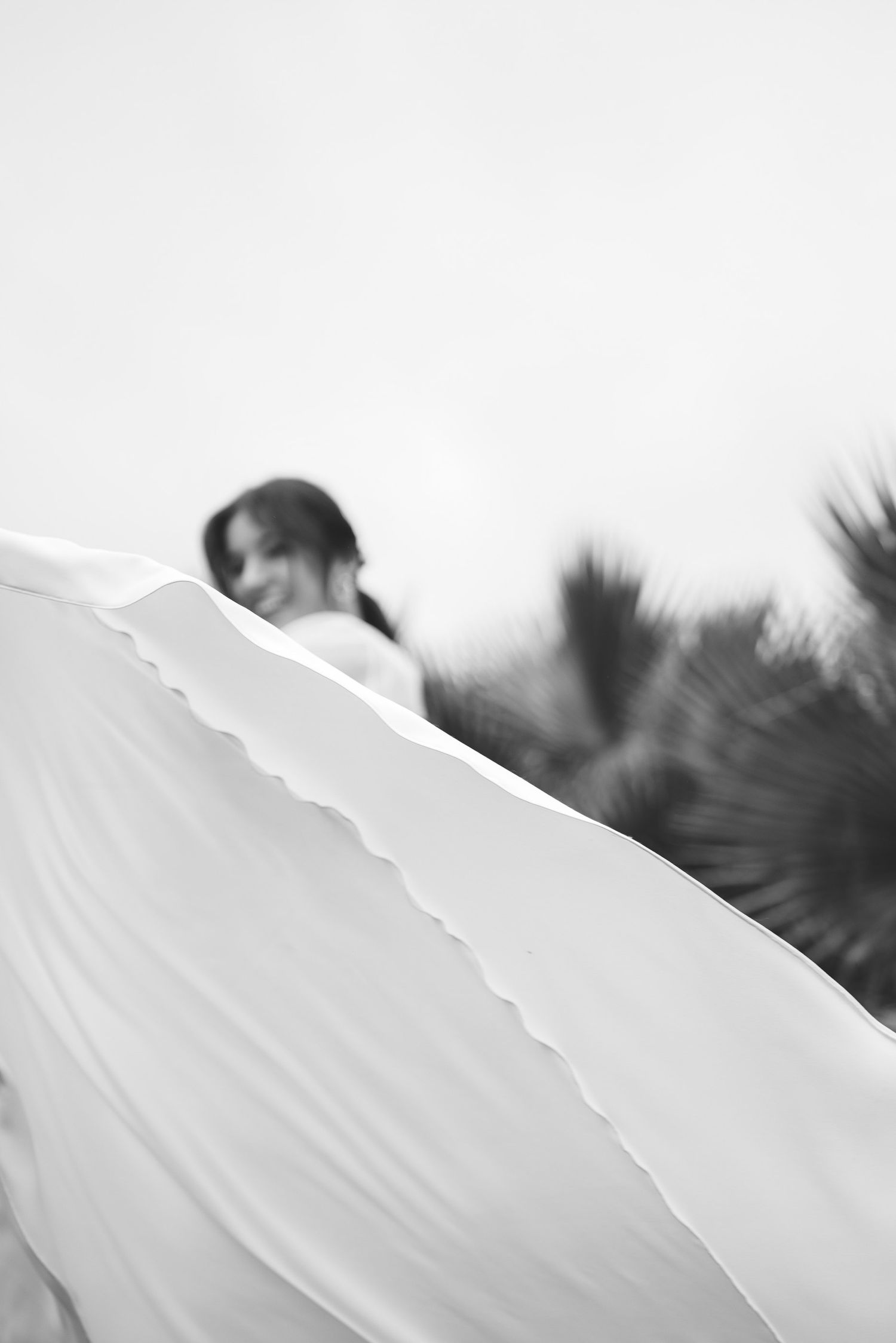 Artistic bridal portrait with flowing wedding dress in Portugal