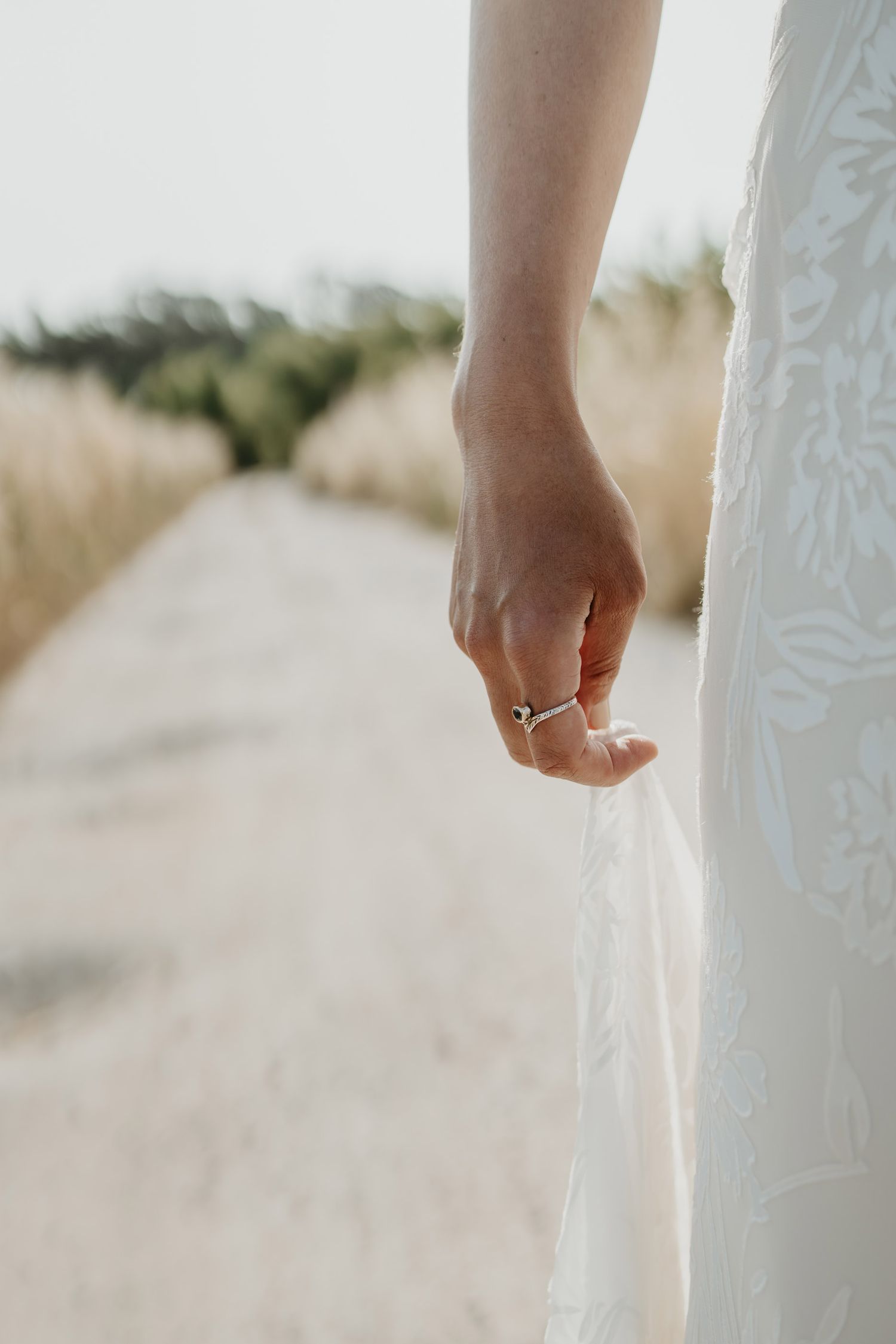 Minimal detail of a bride and her wedding dress in Portugal