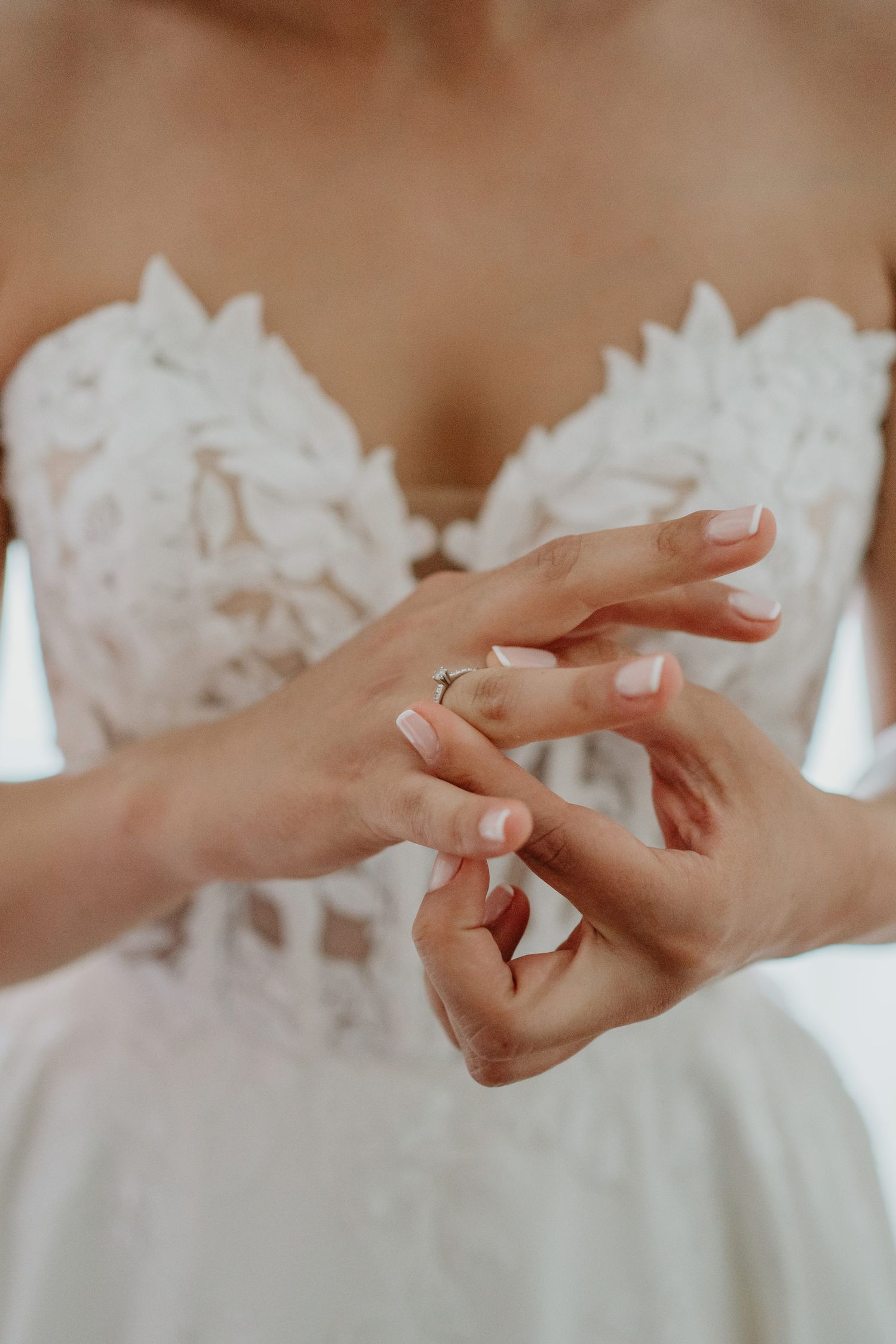 Bride adjusting her wedding rings before the ceremony in Portugal