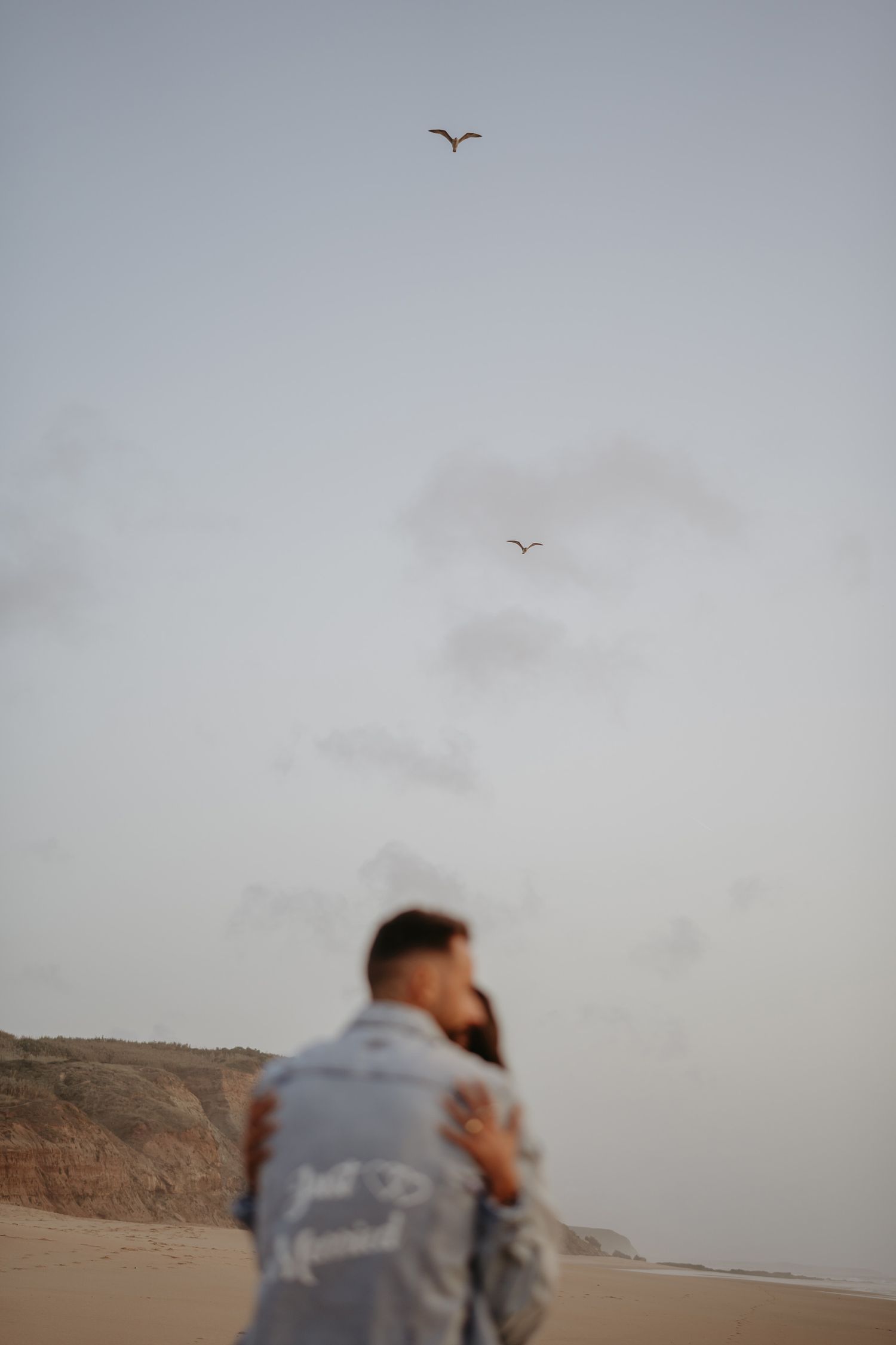 Candid portrait of a groom holding her bride