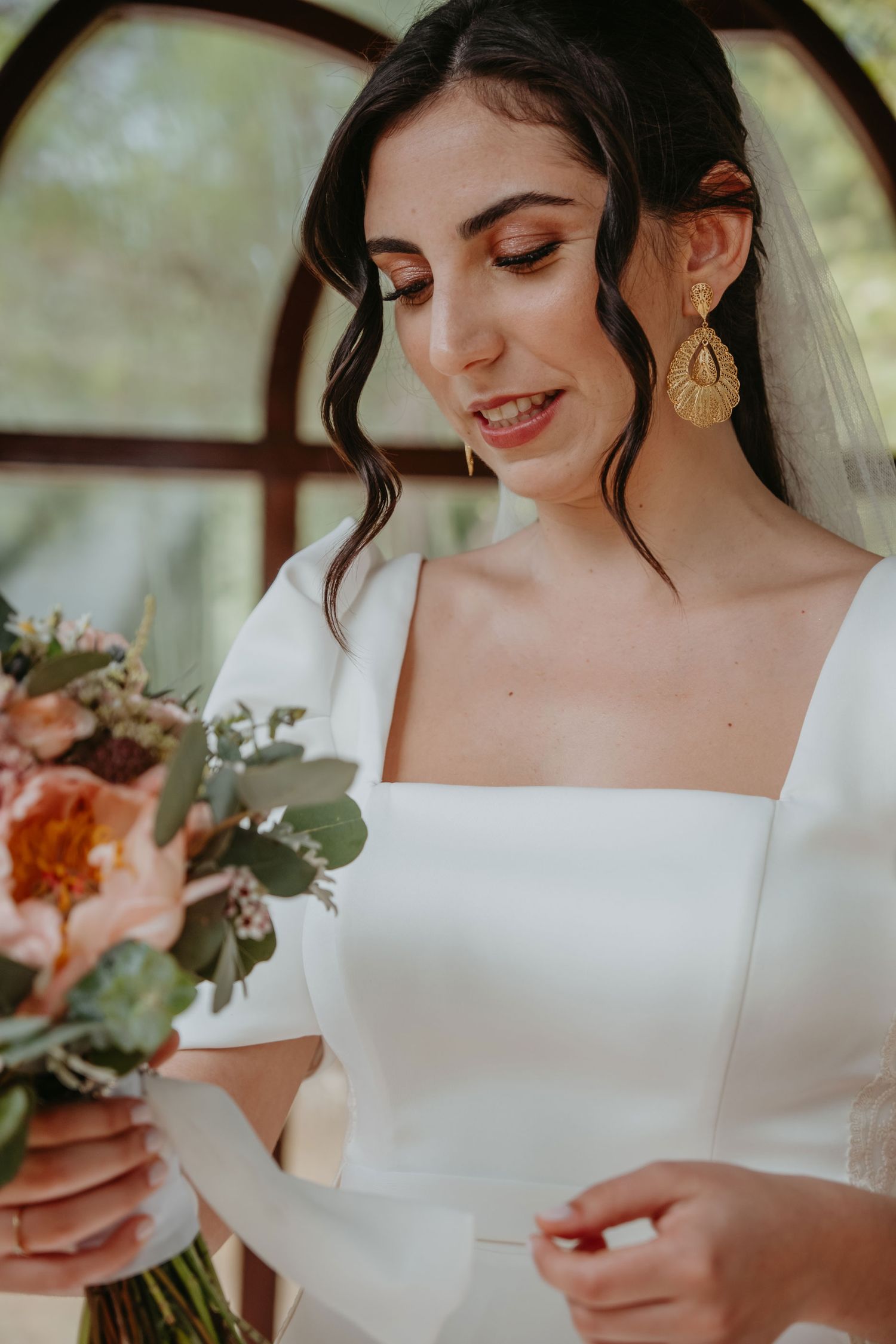 Elegant bridal portrait with bouquet on her wedding day in Portugal