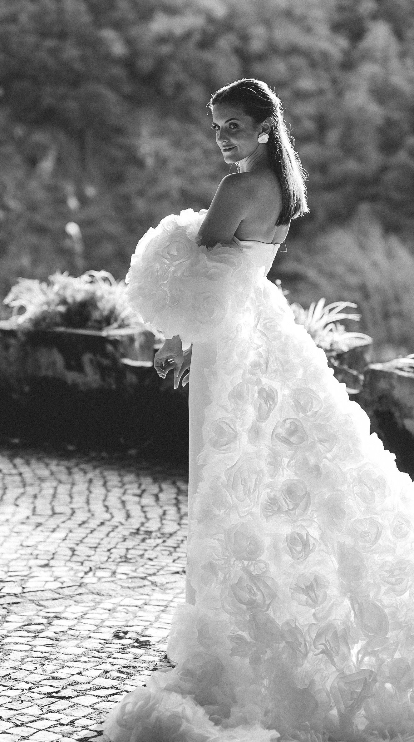 Bride in a couture wedding gown outdoors at Camélia Gardens, Sintra