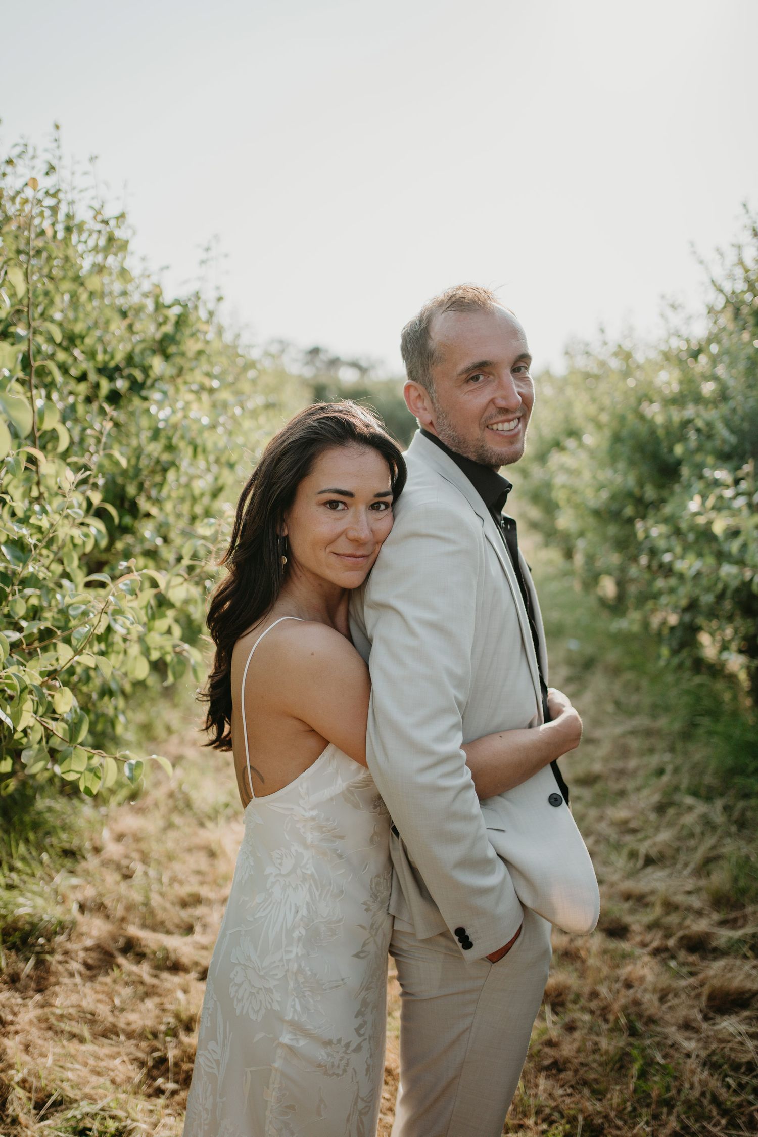 Relaxed portrait of bride and groom at  Rio do Prado wedding in Óbidos, Portugal