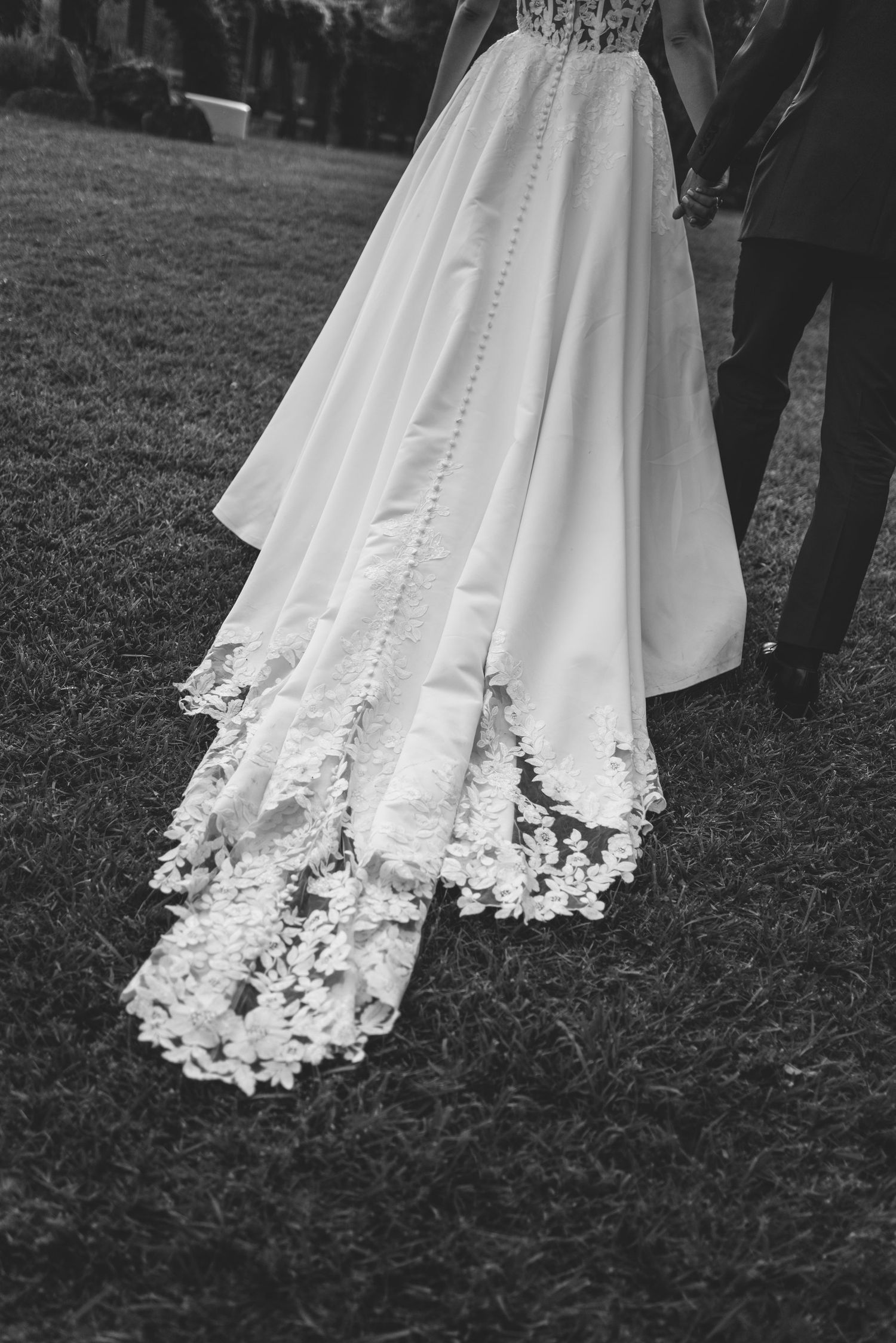 Black and white detail of bride's lace wedding dress in Portugal