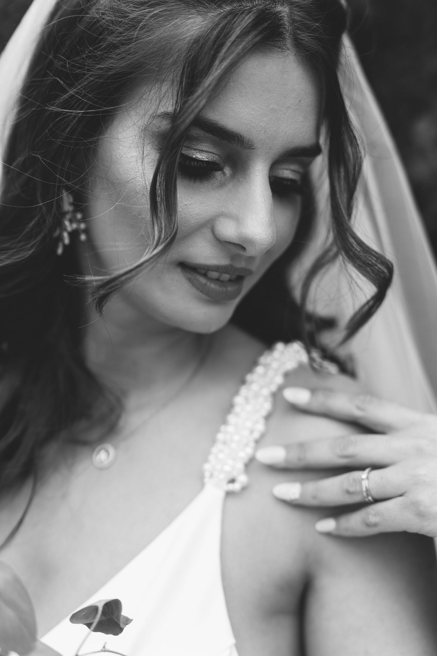 Timeless black and white bridal portrait with veil and wedding dress detail
