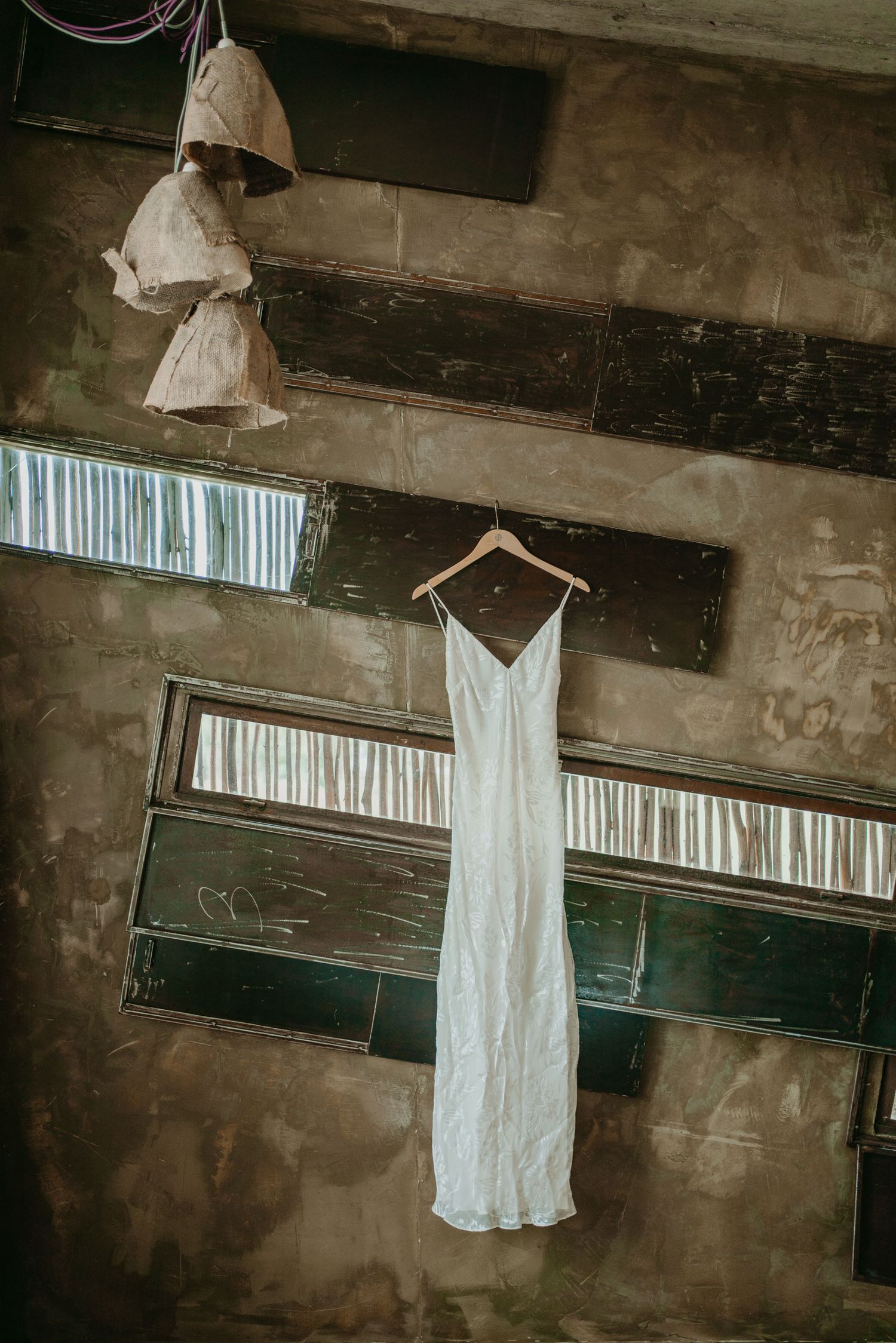 Wedding dress hanging inside Rio do Prado in Óbidos, Portugal