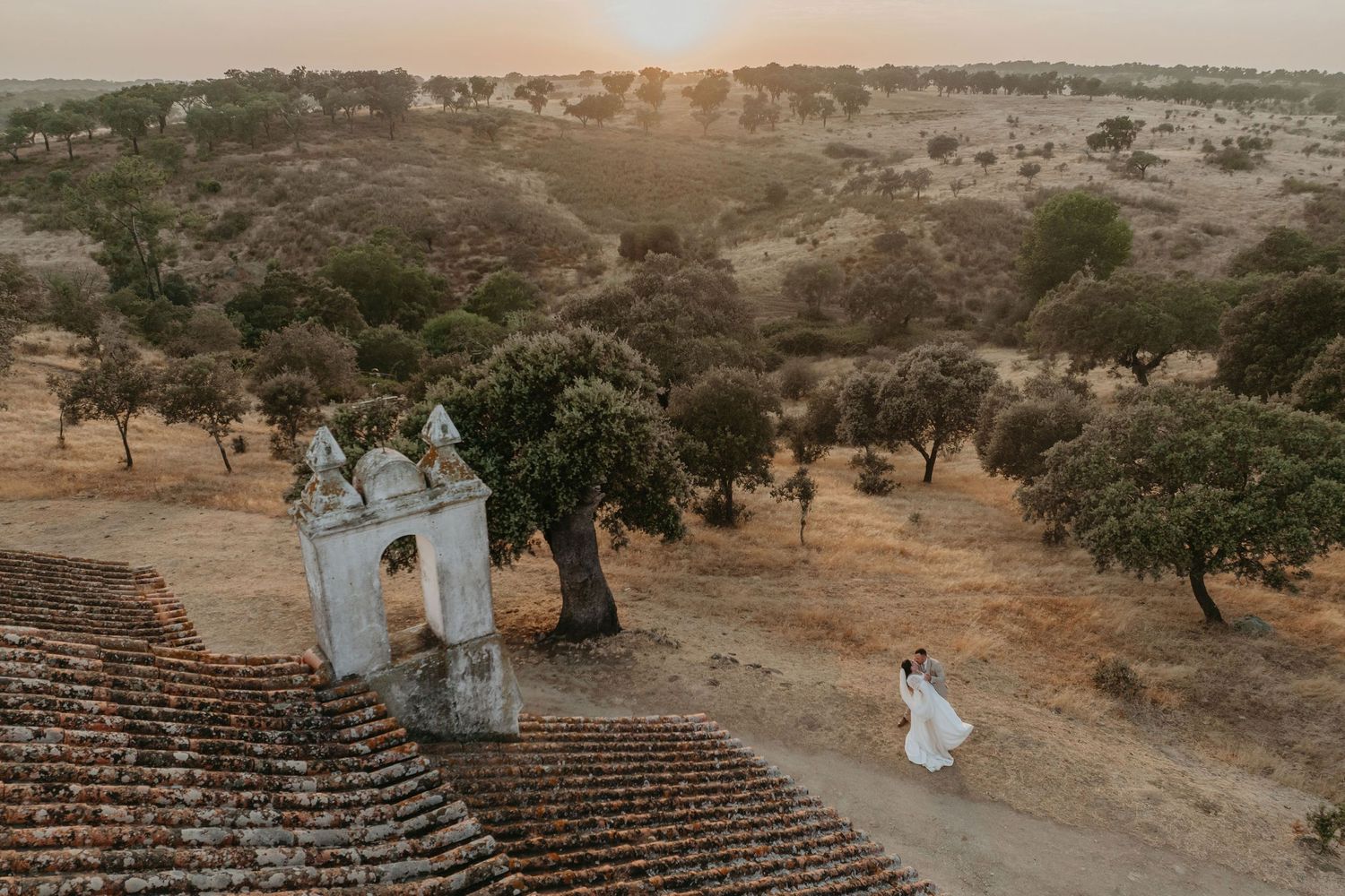 Bride and Groom in the Alentejo landscape at sunset on their wedding day in Portugal