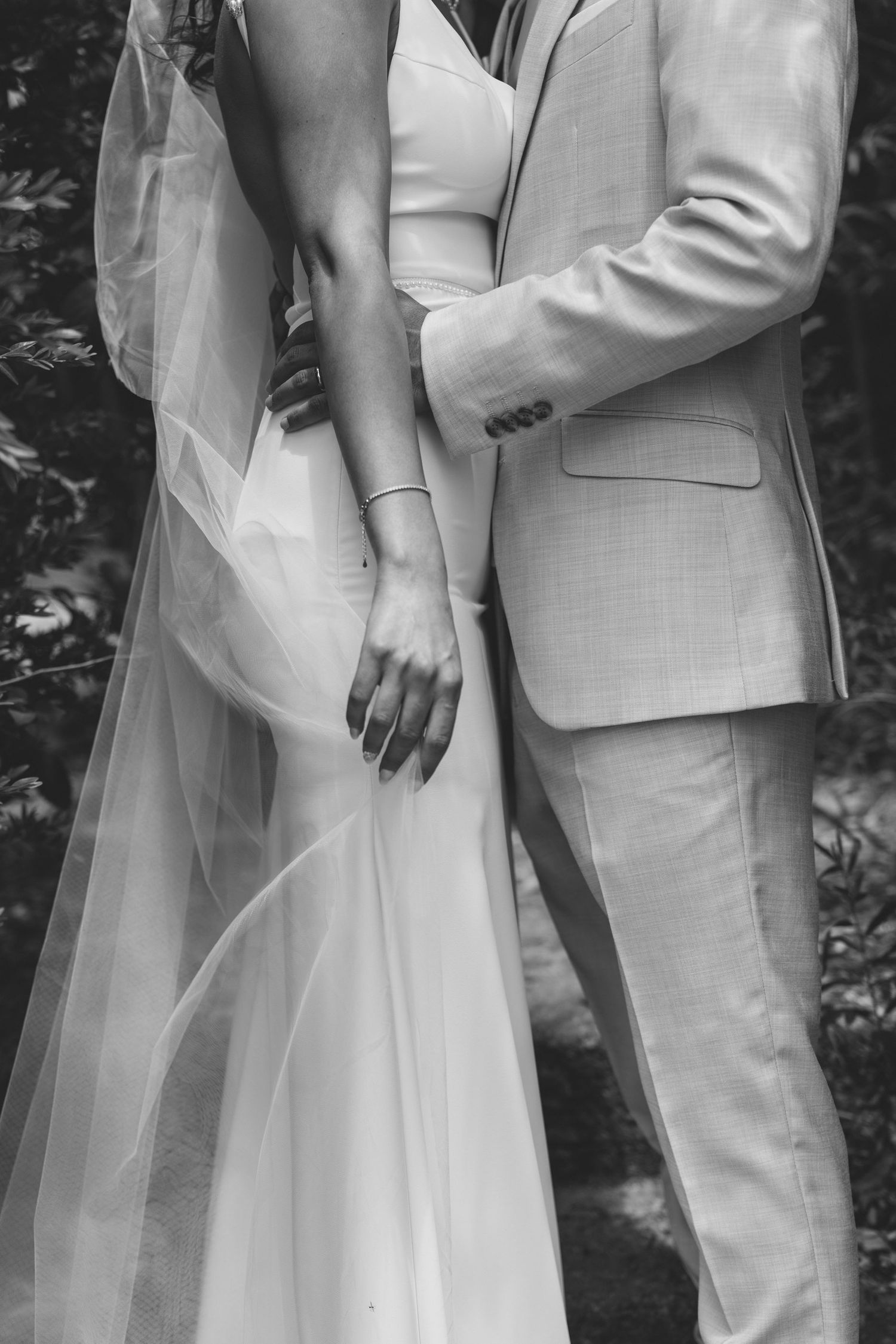 Black and white detail of bride and groom in an intimate wedding portrait