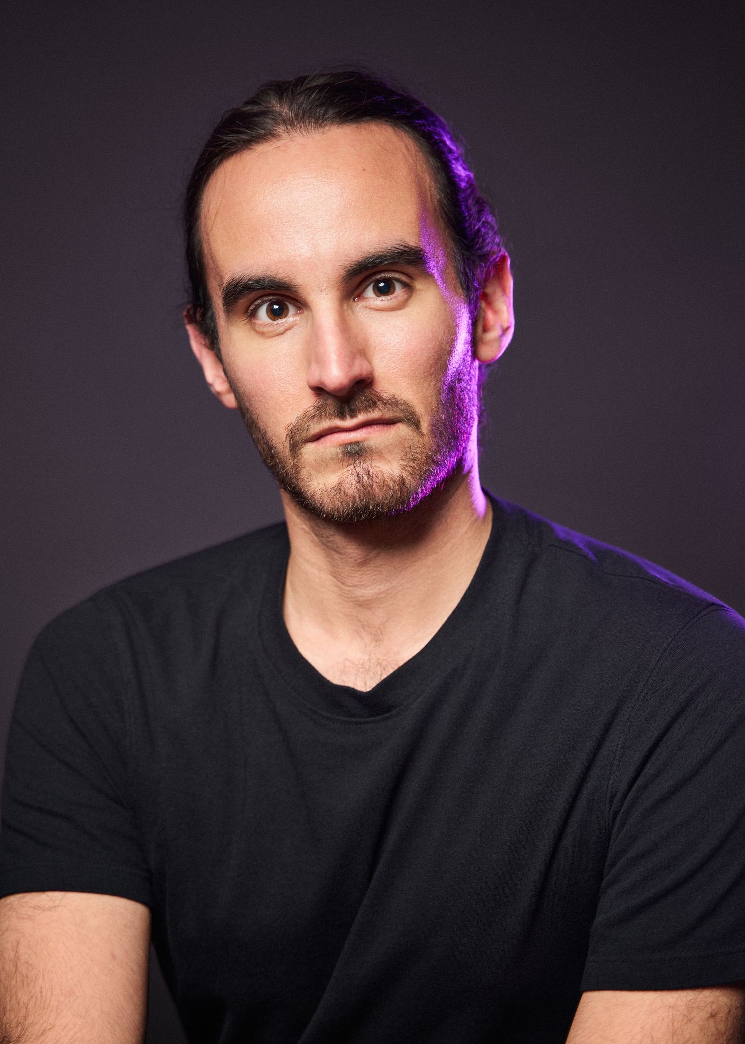 Professional actor headshot with purple edge lighting