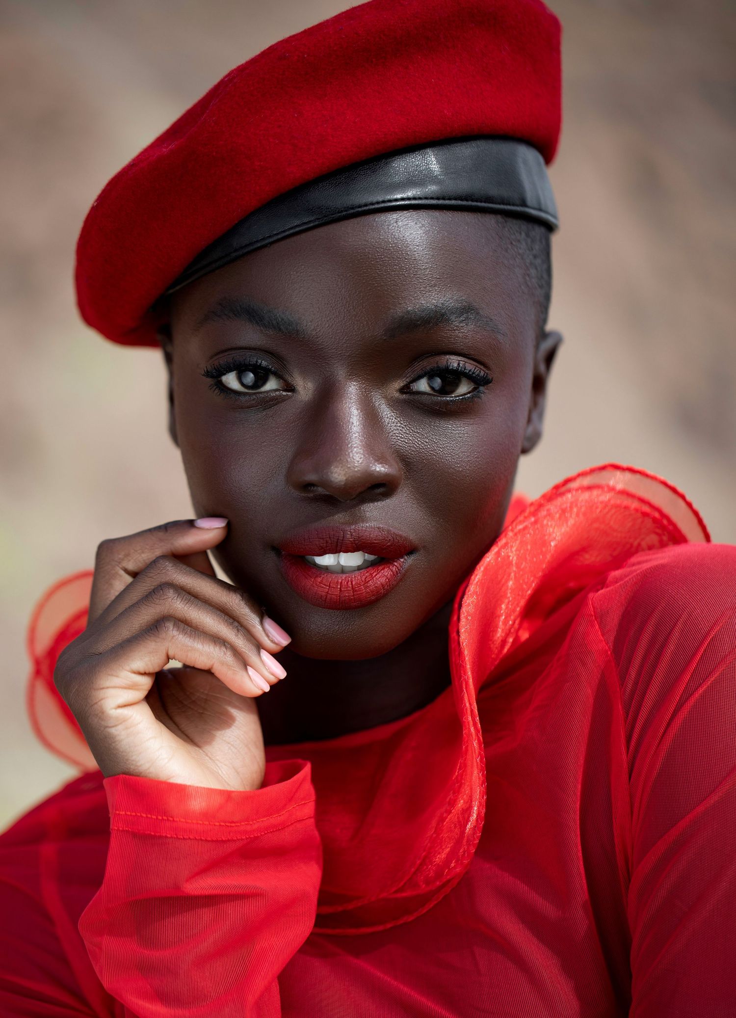 Fashion portraits featuring red beret and matching sweater with dramatic lighting.PZ STUDIO VISUALS