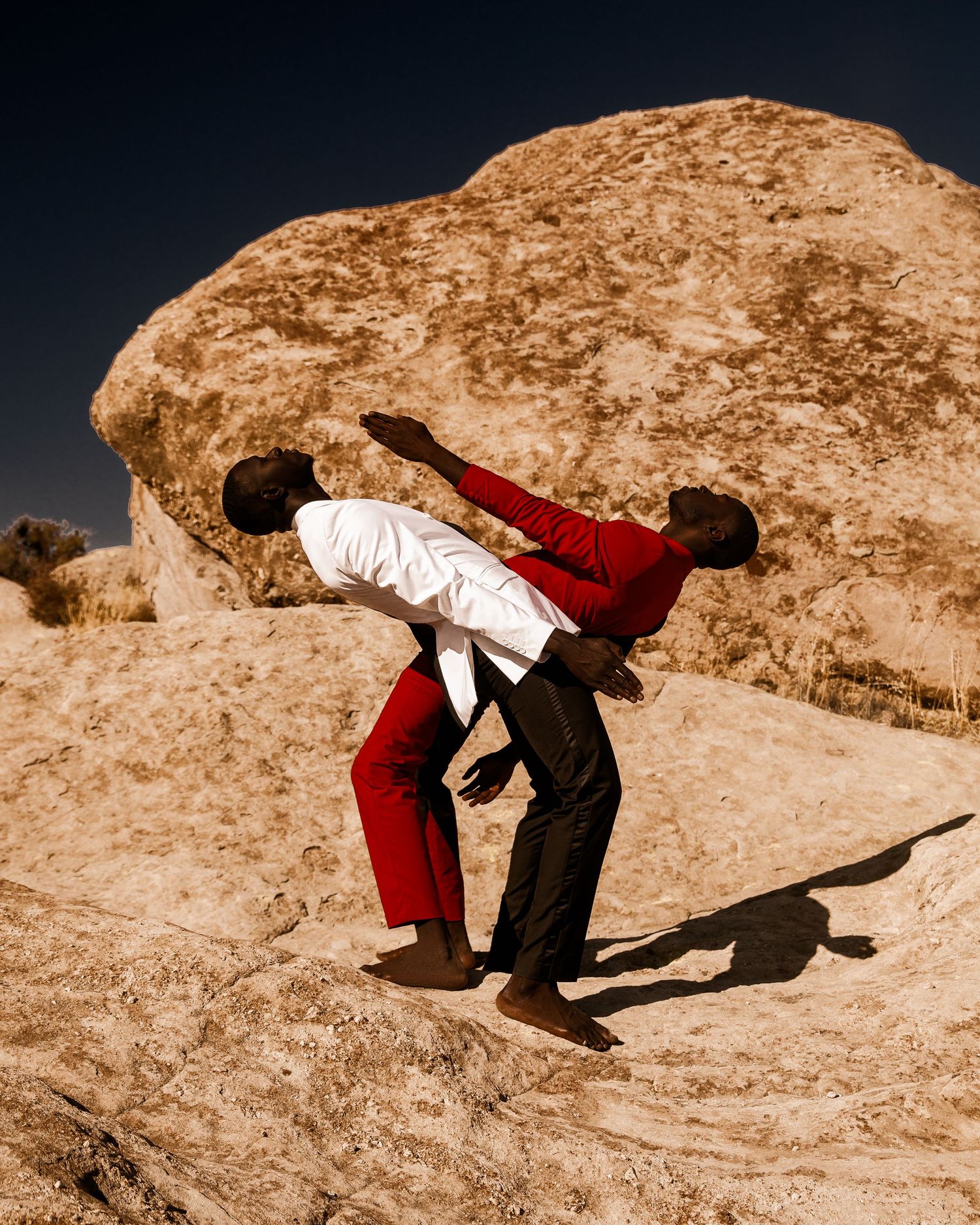 Dynamic dance movements captured in sepia tones against desert landscape.  PZ STUDIO VISUALS photo by Tayo Jr