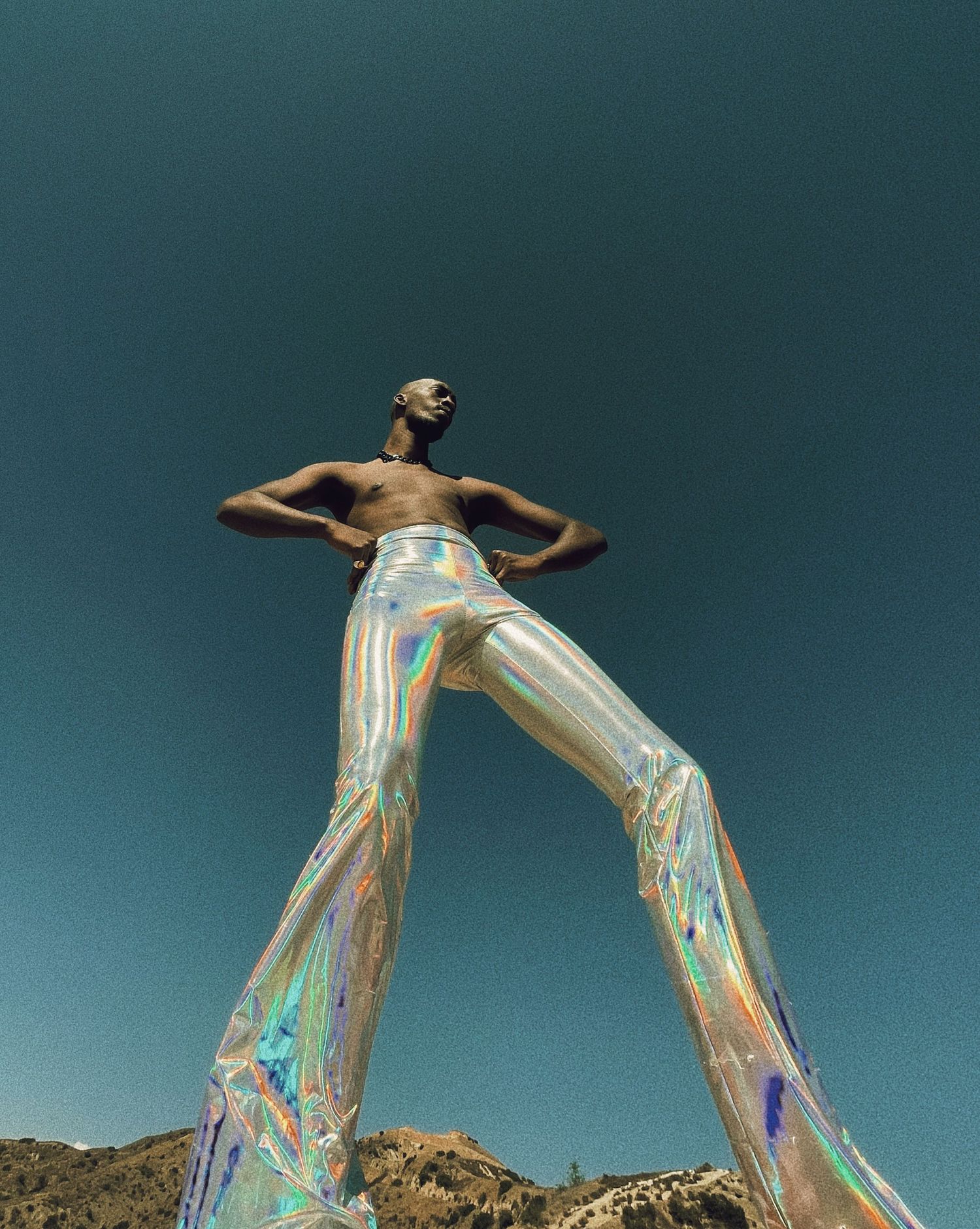 Iridescent fabric dance performance captured against desert landscape. PZ STUDIO VISUALS  x Beoncia Dunn