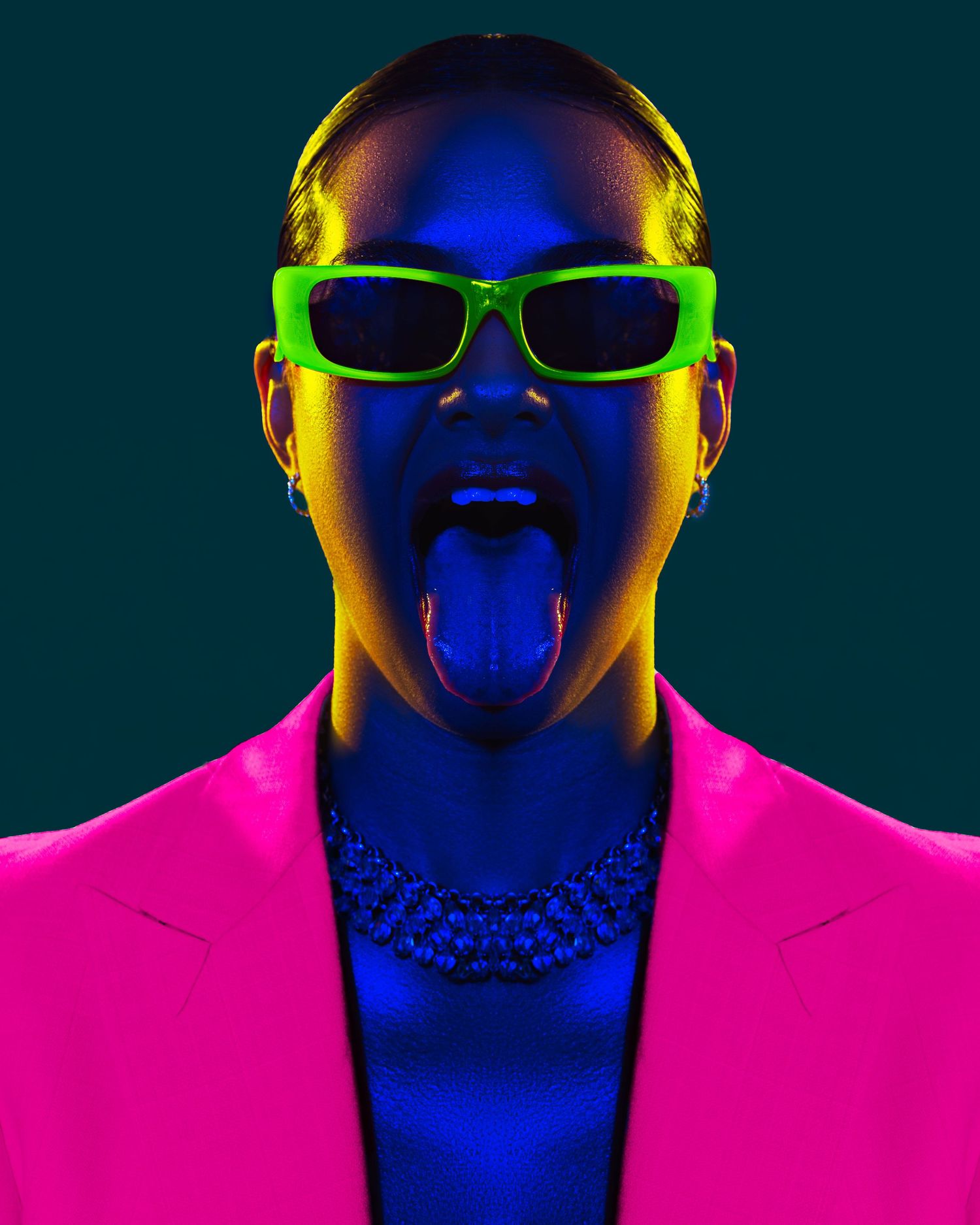 Colorful neon portrait with sunglasses and statement necklace against dark background. PZ STUDIO VISUALS