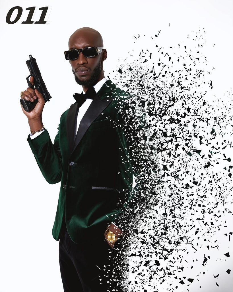 Figure in green suit jacket dissolving into particles against white background.  PZ STUDIO VISUALS  007 now 011 - A NEW DAWN