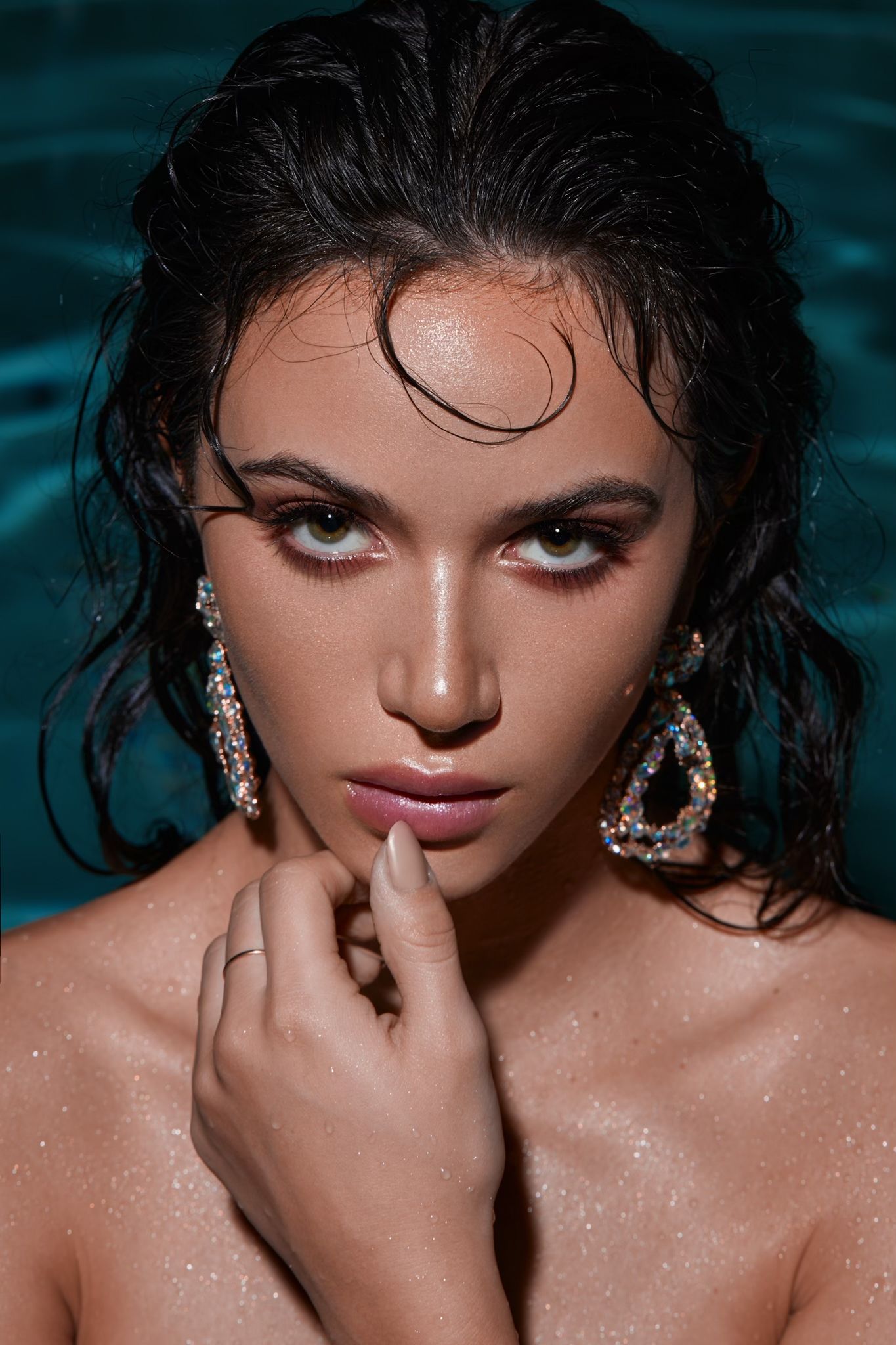Artistic beauty portraits with wet-look hair, sparkling earrings and glamorous makeup in a dark aqua setting. PZ STUDIO VISUALS