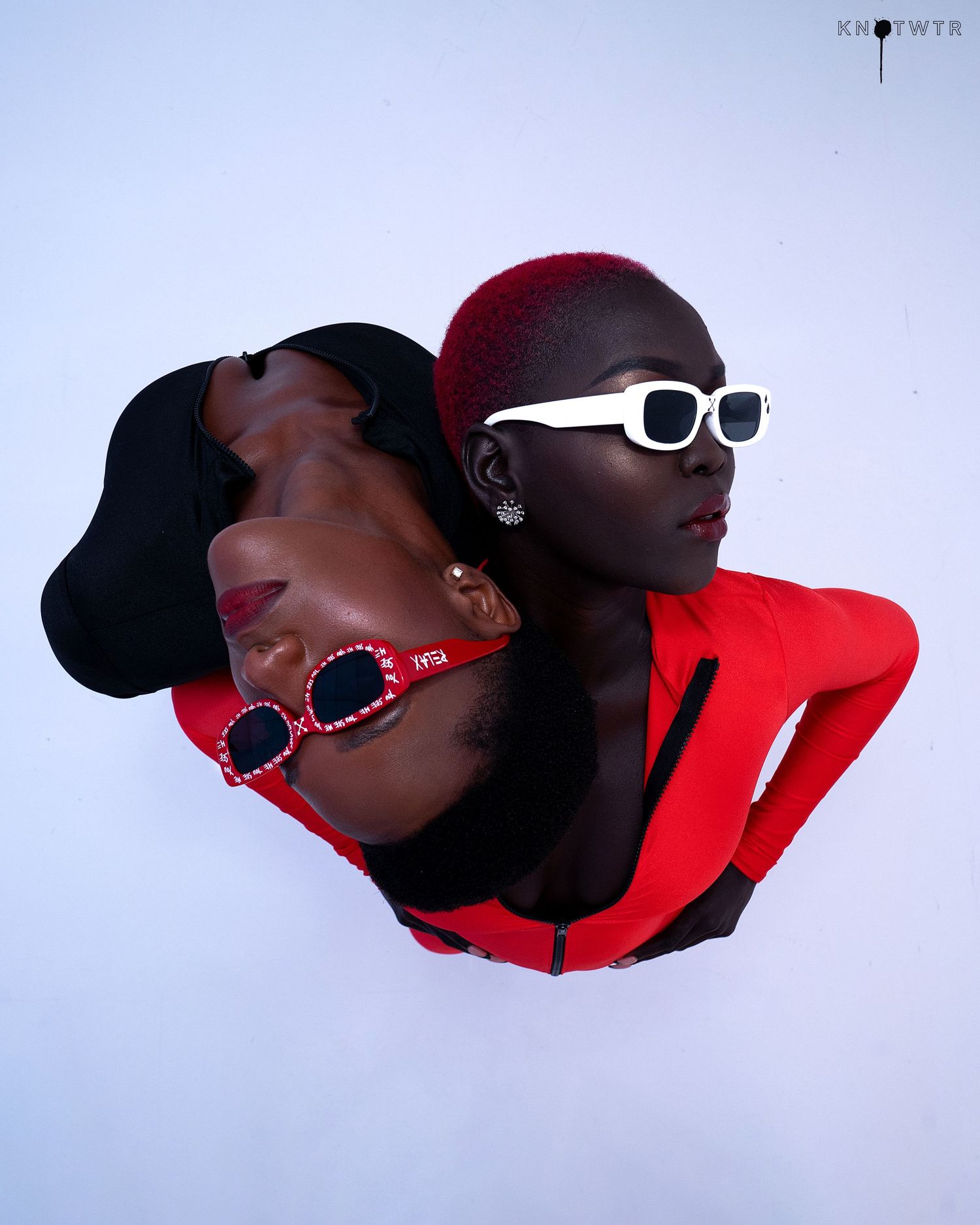 Minimalist fashion series with red and black styling against white background. PZ STUDIO VISUALS