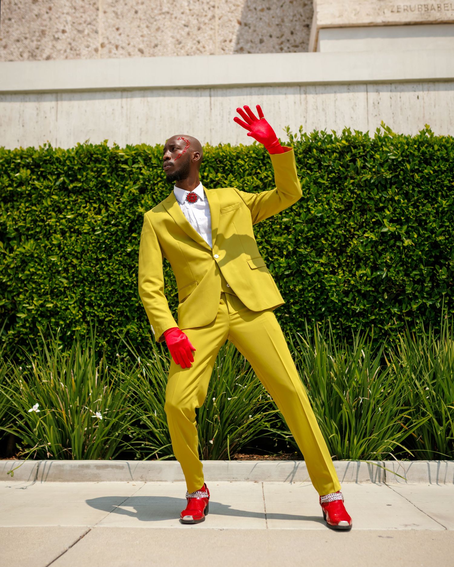 Dynamic poses in yellow suit and red gloves against hedge background. PZ STUDIO VISUALS  x Beoncia Dunn