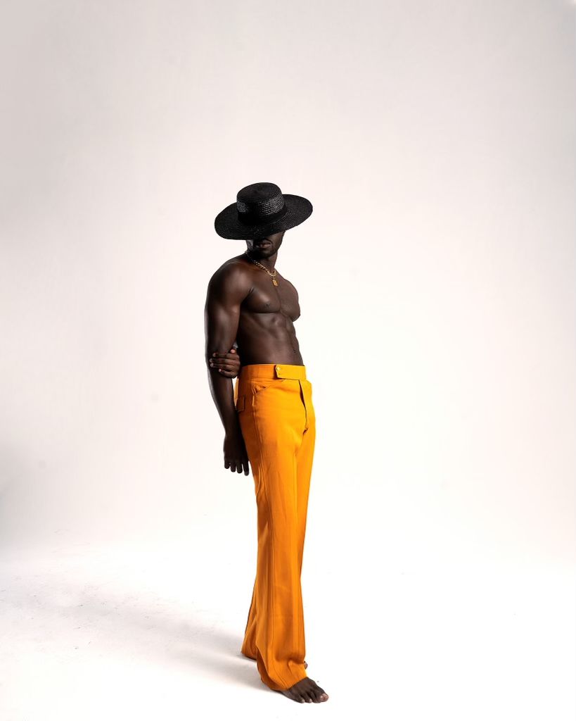 Figure in bright yellow pants against white background in minimalist pose sequence. PZ STUDIO VISUALS