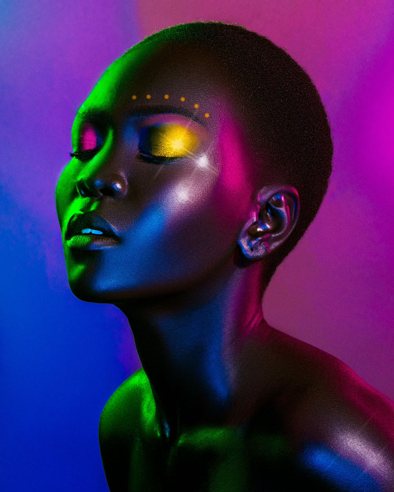 Artistic beauty portrait with colorful lighting and metallic makeup details. Nyakim shot by Essien Akan, assisted PZ STUDIO VISUALS