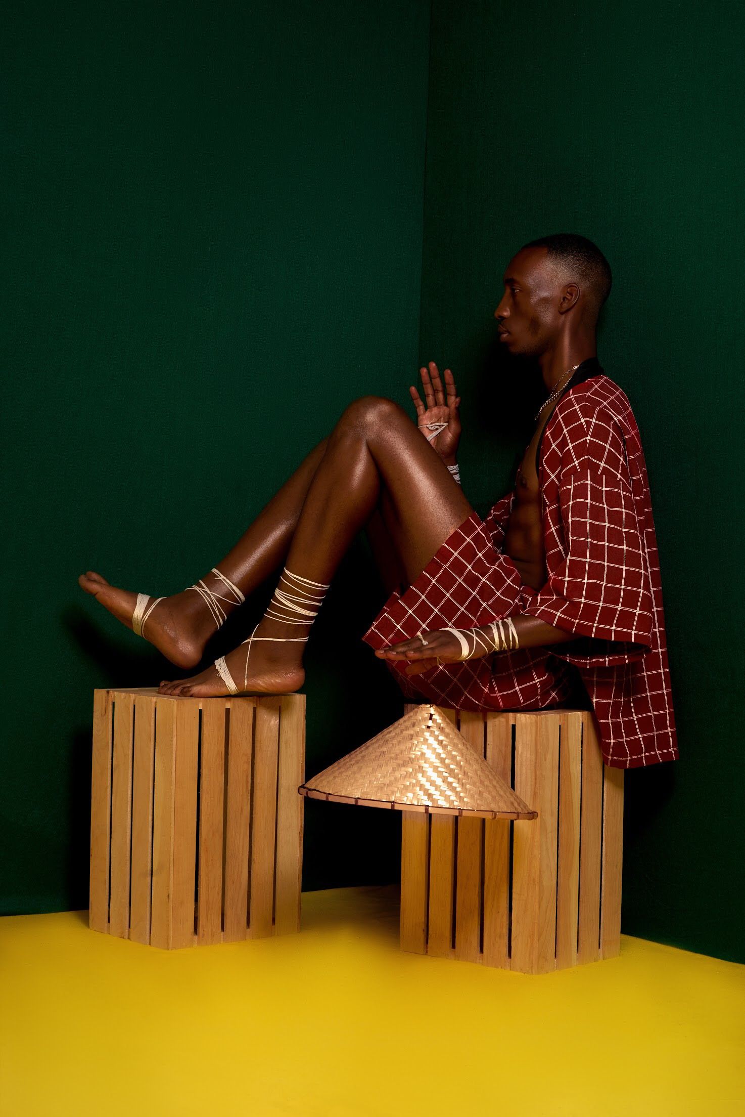 Performance art scene with wooden crates and geometric patterns against dark backdrop.PZ STUDIO VISUALS