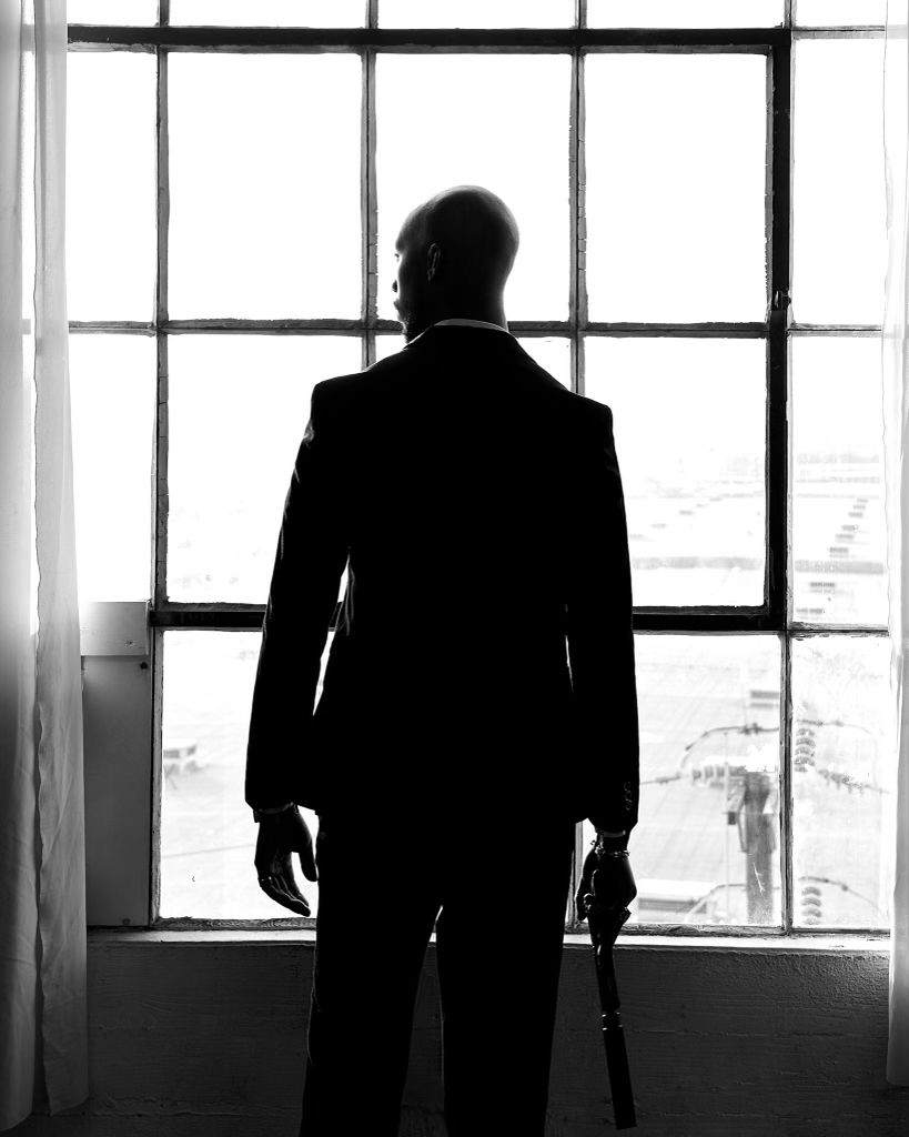 Silhouetted figures standing near large windows in black and white photography.  PZ STUDIO VISUALS  007 now 011 - A NEW DAWN