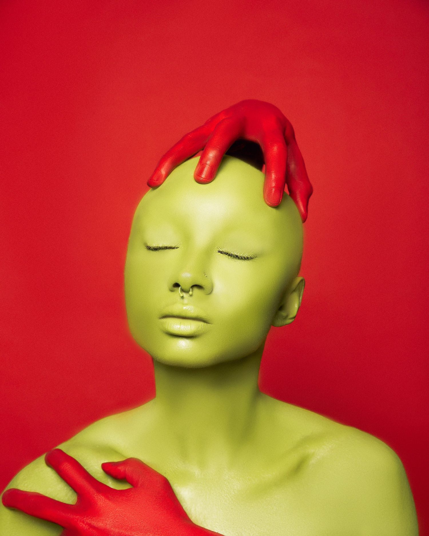 Creative portrait series with neon green body paint and red accents against vibrant red background.